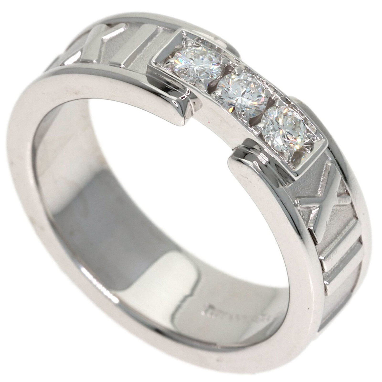 Tiffany Band Ring White Gold (18K): Tiffany Band Ring White Gold (18K) White gold band ring with a diamond stone, crafted by Tiffany. This 18K piece features a classic design and a few traces of usage, showcasing its well-worn character