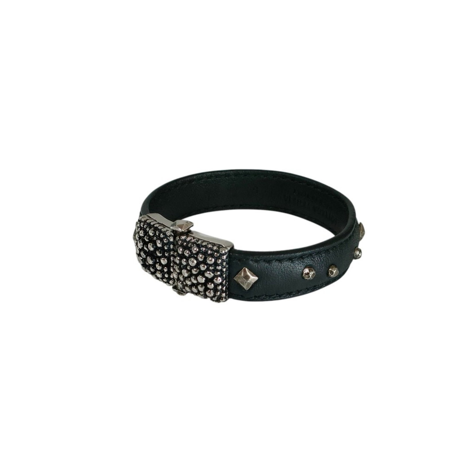 Bangle Leather by Bottega: Bangle Leather by Bottega Bangle Leather by Bottega Veneta features a sleek black leather design with silver accents, measuring 18cm in length. This used item is in like new condition, with hardly any