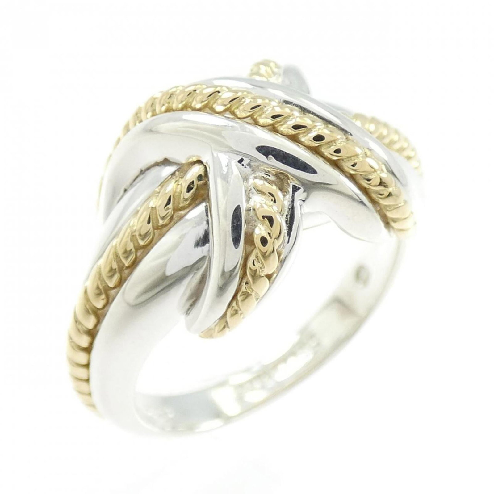 Tiffany Band Ring Silver 925 Yellow Gold (18K): Tiffany Band Ring Silver 925 Yellow Gold (18K) Silver 925 Yellow Gold (18K) band ring from Tiffany, featuring a classic design with subtle yellow gold accents. The item shows some signs of wear,