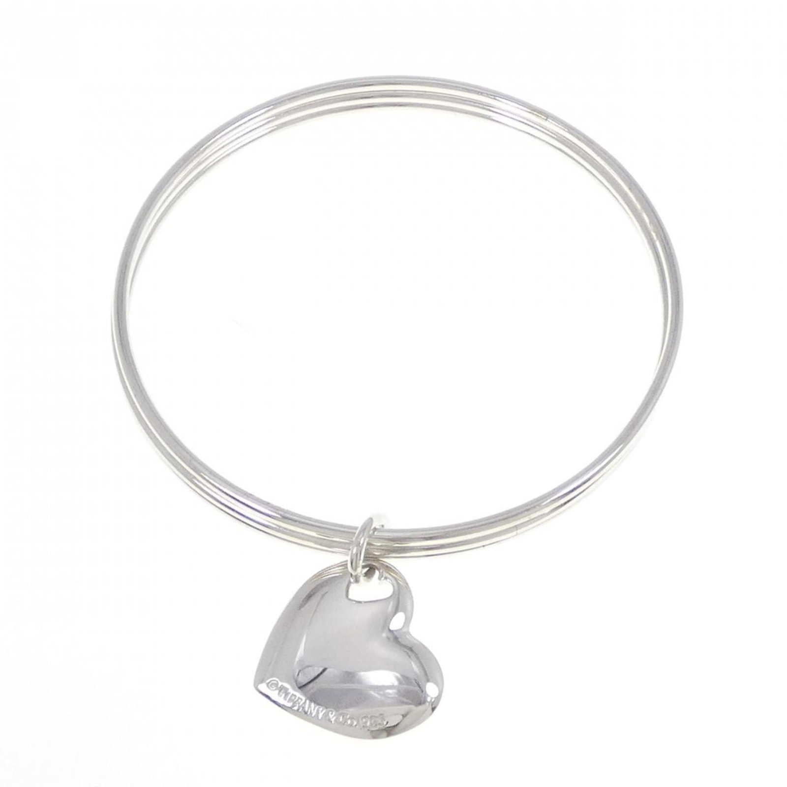 Silver Bangle Tiffany: Silver Bangle Tiffany Silver Bangle Tiffany features a 19cm length and is made from high-quality silver 925 material, giving it a luxurious feel. The bangle bears a few traces of usage, with some scra