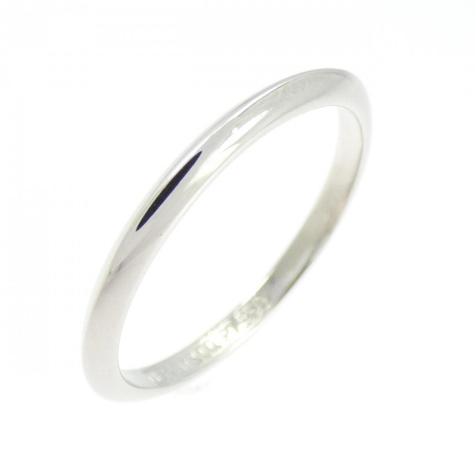 Platinum ring by Tiffany band: Platinum ring by Tiffany band Platinum ring by Tiffany features a sleek silver band with a subtle shine, crafted from high-quality platinum material. The ring bears minor signs of usage, including
