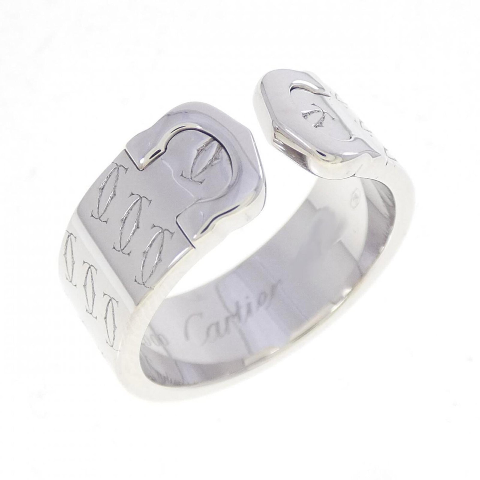 White Gold Cartier Band Ring 18K: White Gold Cartier Band Ring 18K This 18K white gold band ring from Cartier features a classic design. The ring bears a few traces of usage, with some minor scratches and dirt visible, but remains in 