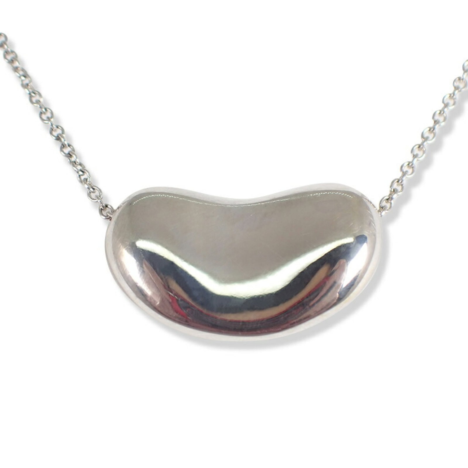 Tiffany 925 Bean Pendant Necklace: Tiffany 925 Bean Pendant Necklace Sterling silver pendant necklace from Tiffany, featuring a 925 hallmark for durability and quality. The necklace boasts a classic design with a bean-shaped pendant,