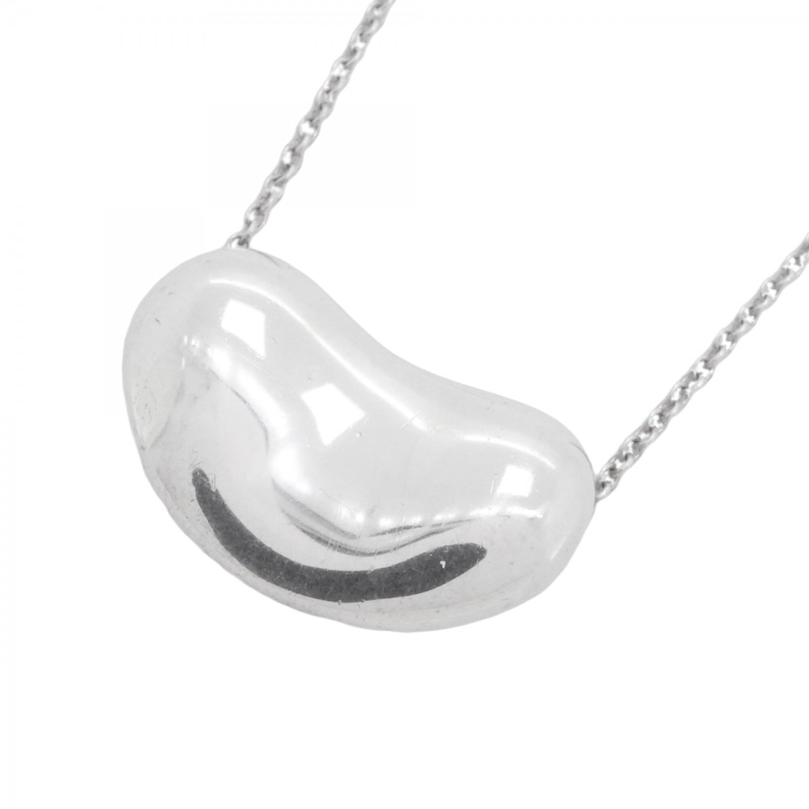 Tiffany & Co. Bean Necklace Sterling Silver 925 Women'S: Tiffany & Co. Bean Necklace Sterling Silver 925 Women'S Tiffany & Co. Bean Necklace in Sterling Silver 925 features a delicate design with a 12.1mm x 19.3mm pendant, suspended from a 42 cm / 16.53'' s