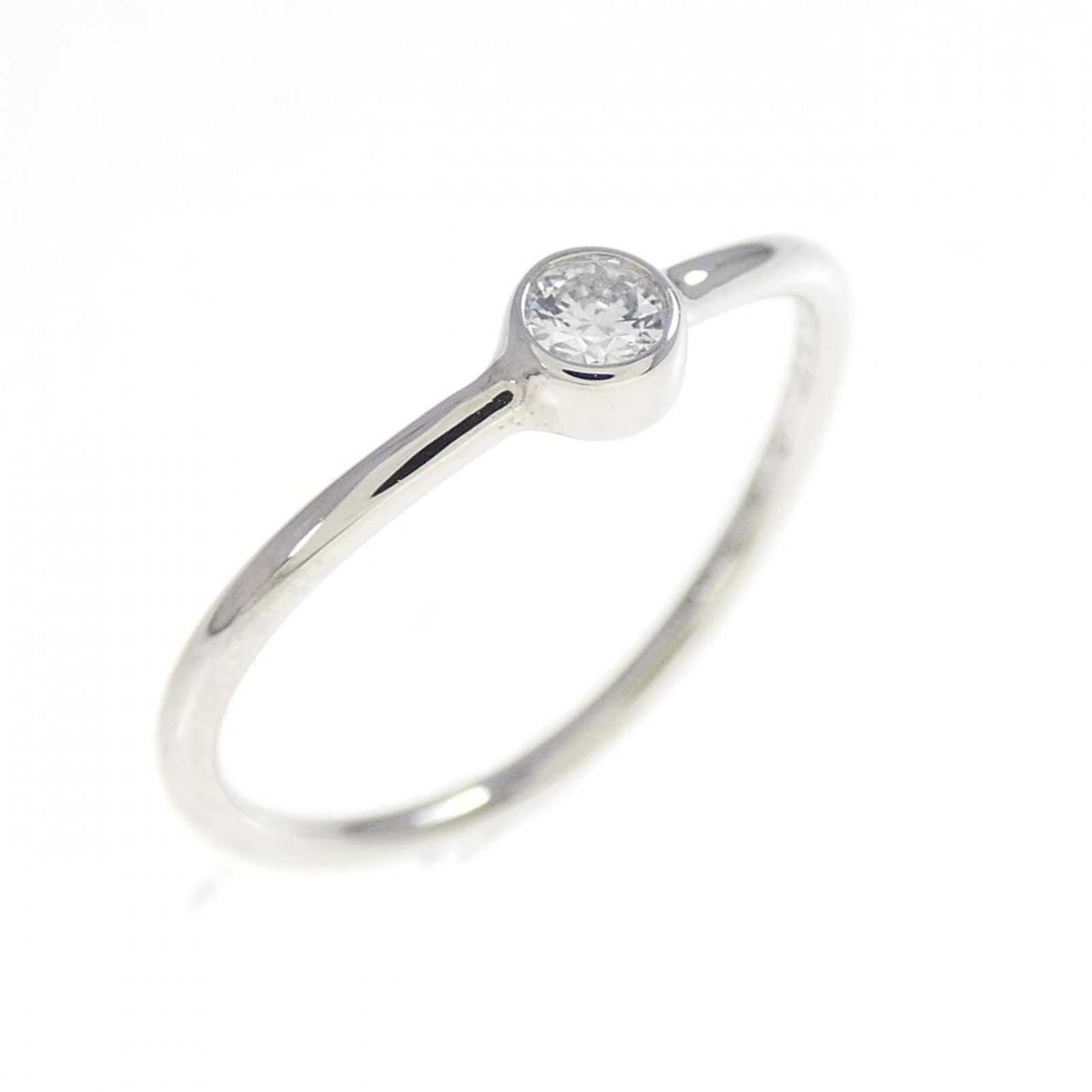 Platinum ring by Tiffany band: Platinum ring by Tiffany band Platinum ring by Tiffany features a band design made from high-quality platinum, with a US size 3.5 to fit comfortably on most women's fingers. The item bears some minor 