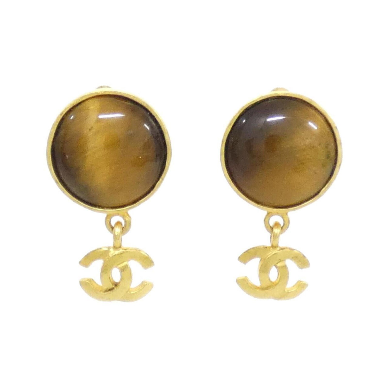 Chanel Clip Earrings: Chanel Clip Earrings Brown and gold Chanel clip earrings with a classic design, featuring a subtle brown tone and elegant gold accents. The earrings are in very good condition, showing some minor