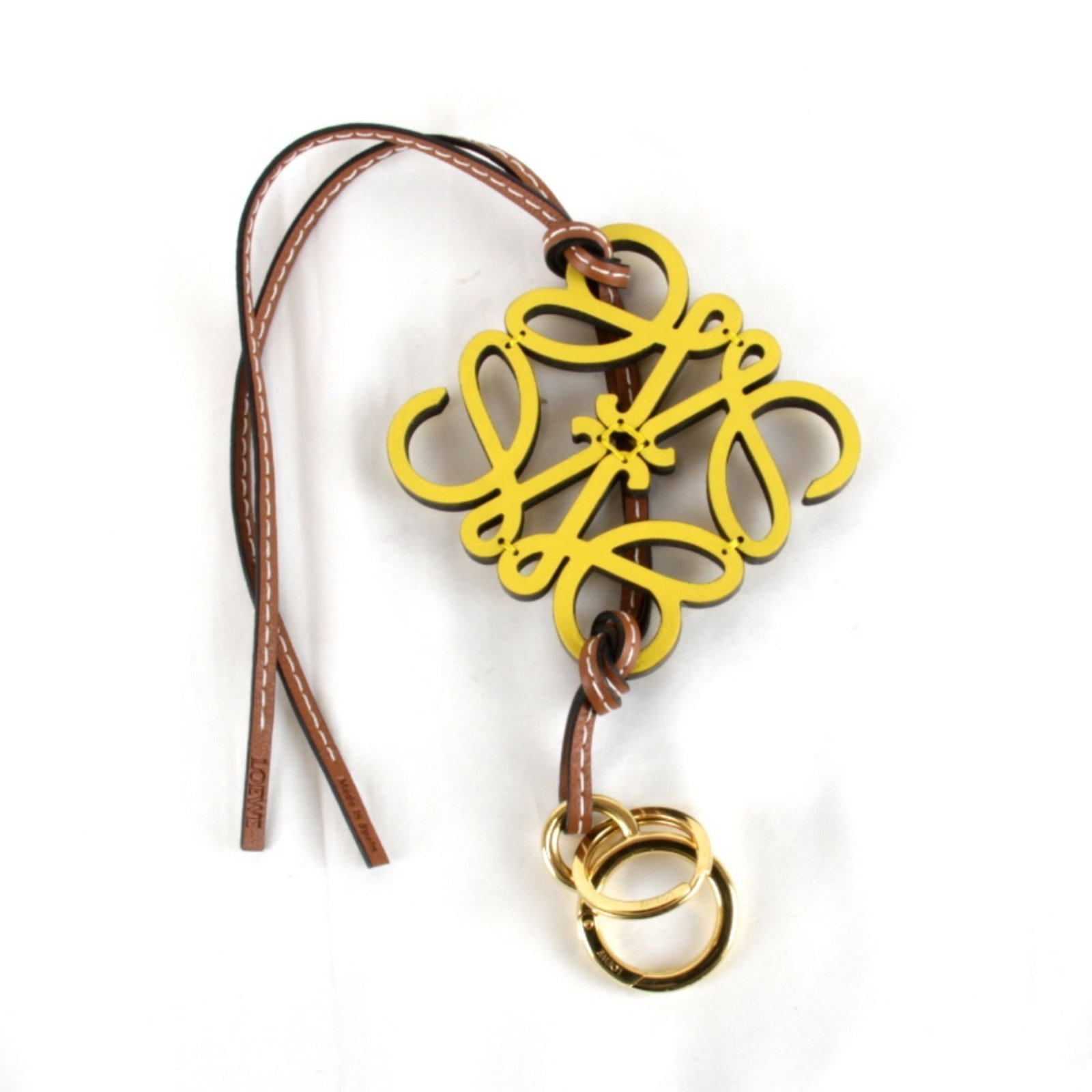Charm Leather Handbag Loewe: Charm Leather Handbag Loewe Yellow Charm Leather Handbag from Loewe, in mint condition like new. Made from high-quality leather, this iconic handbag features the signature charm design that has become