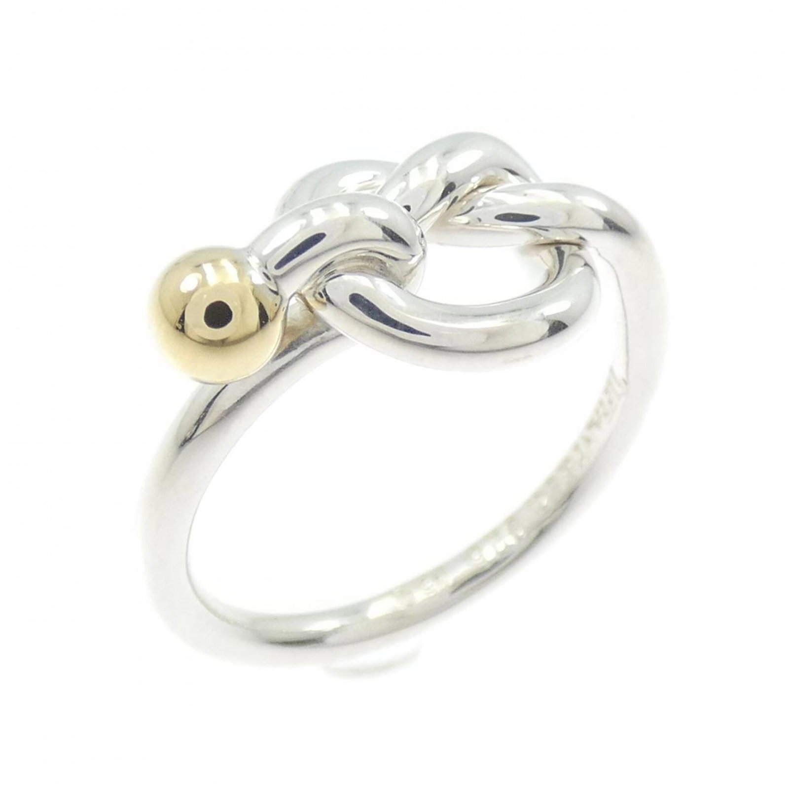 Tiffany Band Ring Silver 925 Yellow Gold (18K): Tiffany Band Ring Silver 925 Yellow Gold (18K) Silver 925 Yellow Gold (18K) band ring from Tiffany, featuring a classic design with subtle yellow gold accents. The item shows some signs of wear, inclu