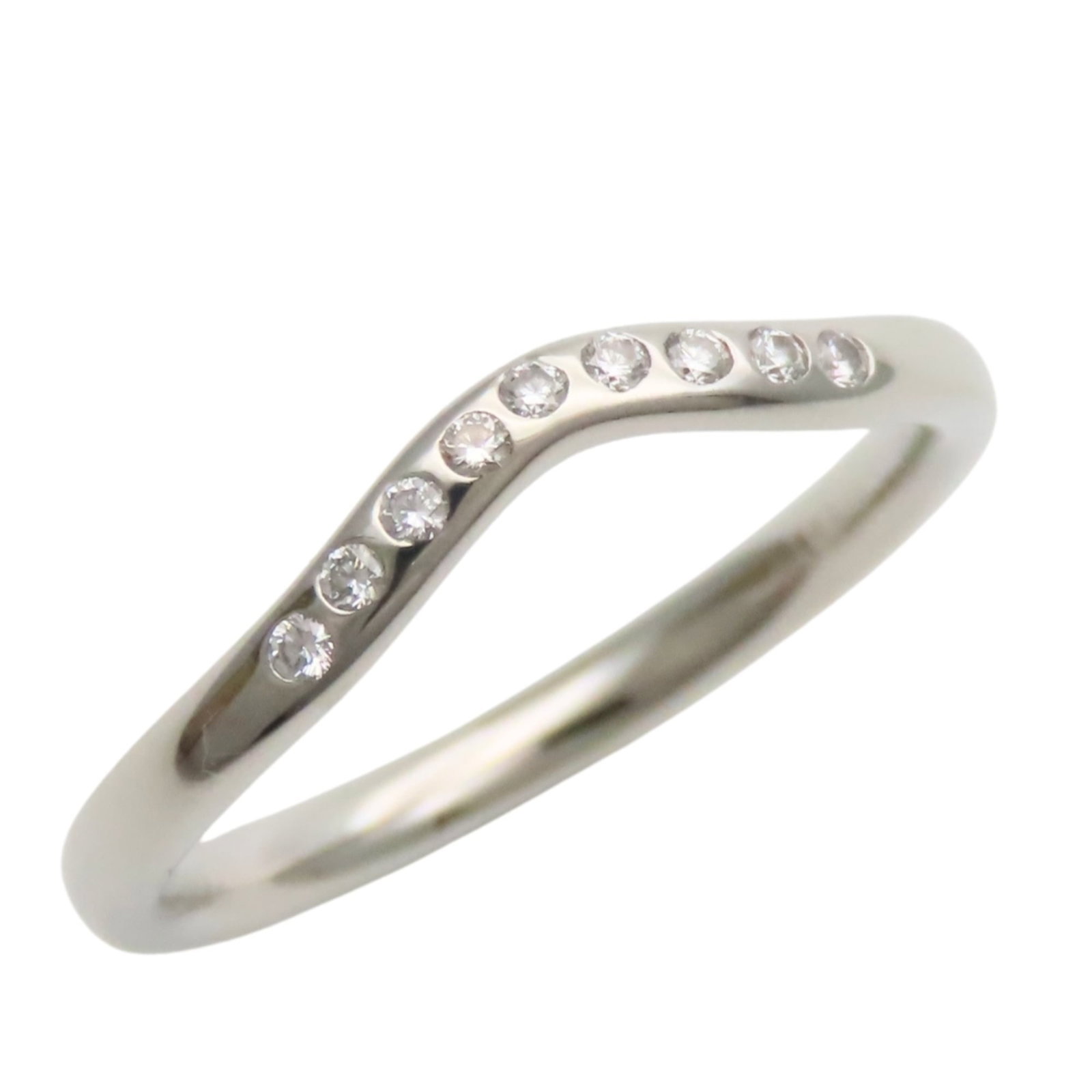 Platinum ring by Tiffany band: Platinum ring by Tiffany band Platinum ring by Tiffany features a classic band design, showcasing the luxury of platinum 950 material. The item bears some scratches and minor traces of usage but