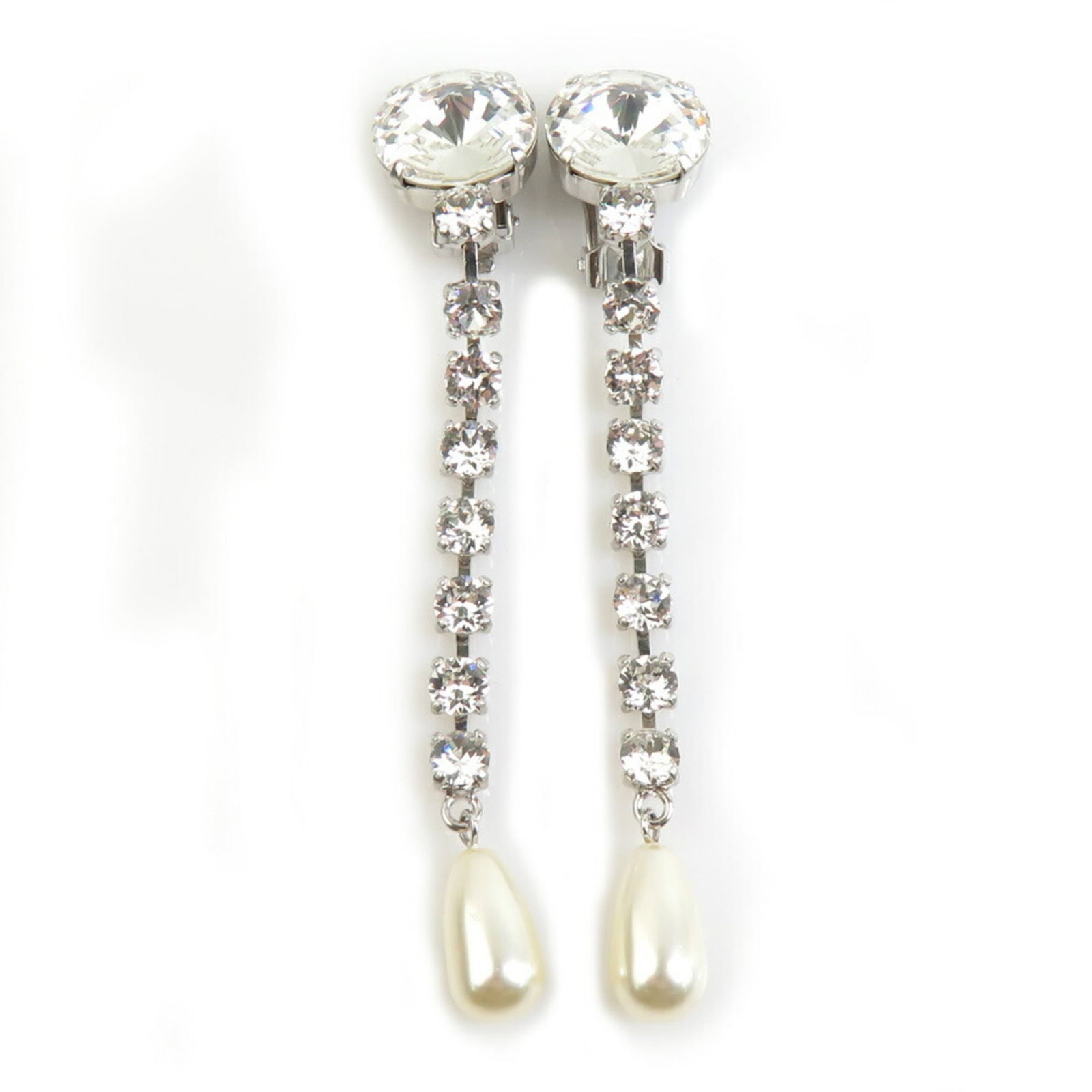 Metal Pearl Drop Earrings Artificial: Metal Pearl Drop Earrings Artificial Metal Pearl Drop Earrings Artificial, crafted from high-quality artificial pearl and metal, feature a sleek silver finish. With a subtle white hue, these elegant