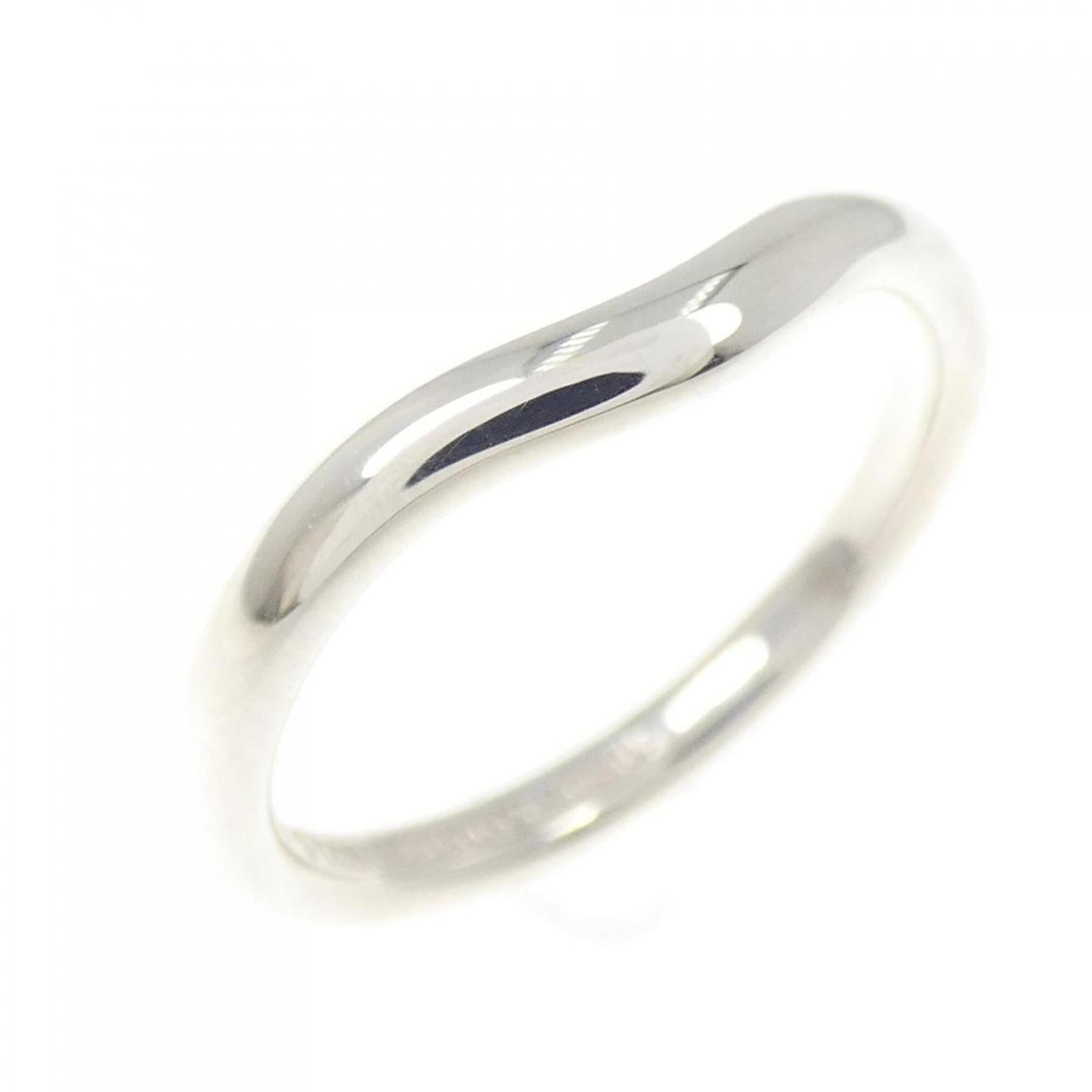 Tiffany Curved Ring: Tiffany Curved Ring Silver Tiffany Curved Ring, 925 Sterling. A few traces of usage and minor scratches can be seen on the silver surface, but overall in very good condition. This curved ring bears a