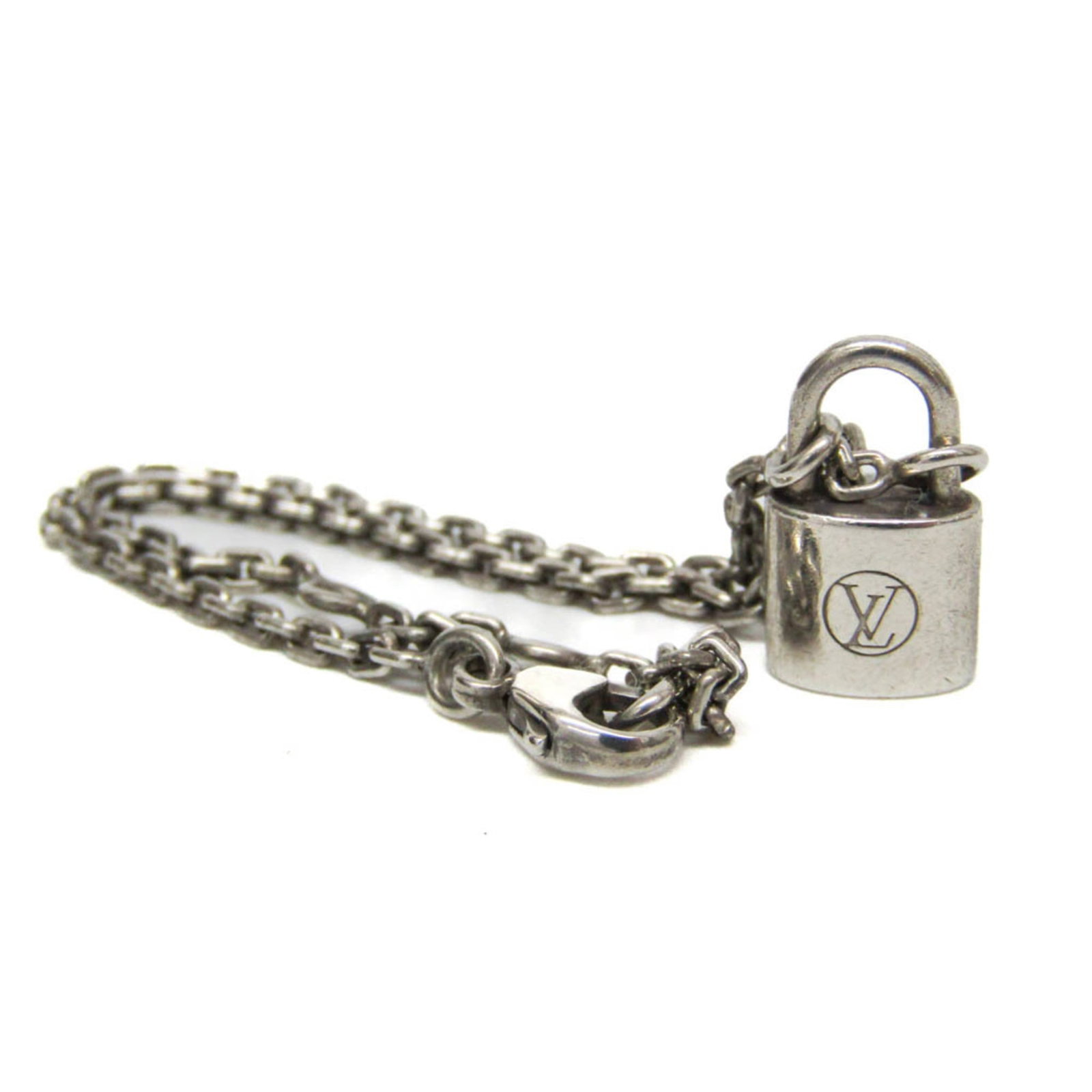 Louis Vuitton Charm Bracelet Silver: Louis Vuitton Charm Bracelet Silver Silver Louis Vuitton Charm Bracelet, featuring the iconic LV monogram pattern in sterling silver. This fashion accessory boasts a sleek design and measures between 
