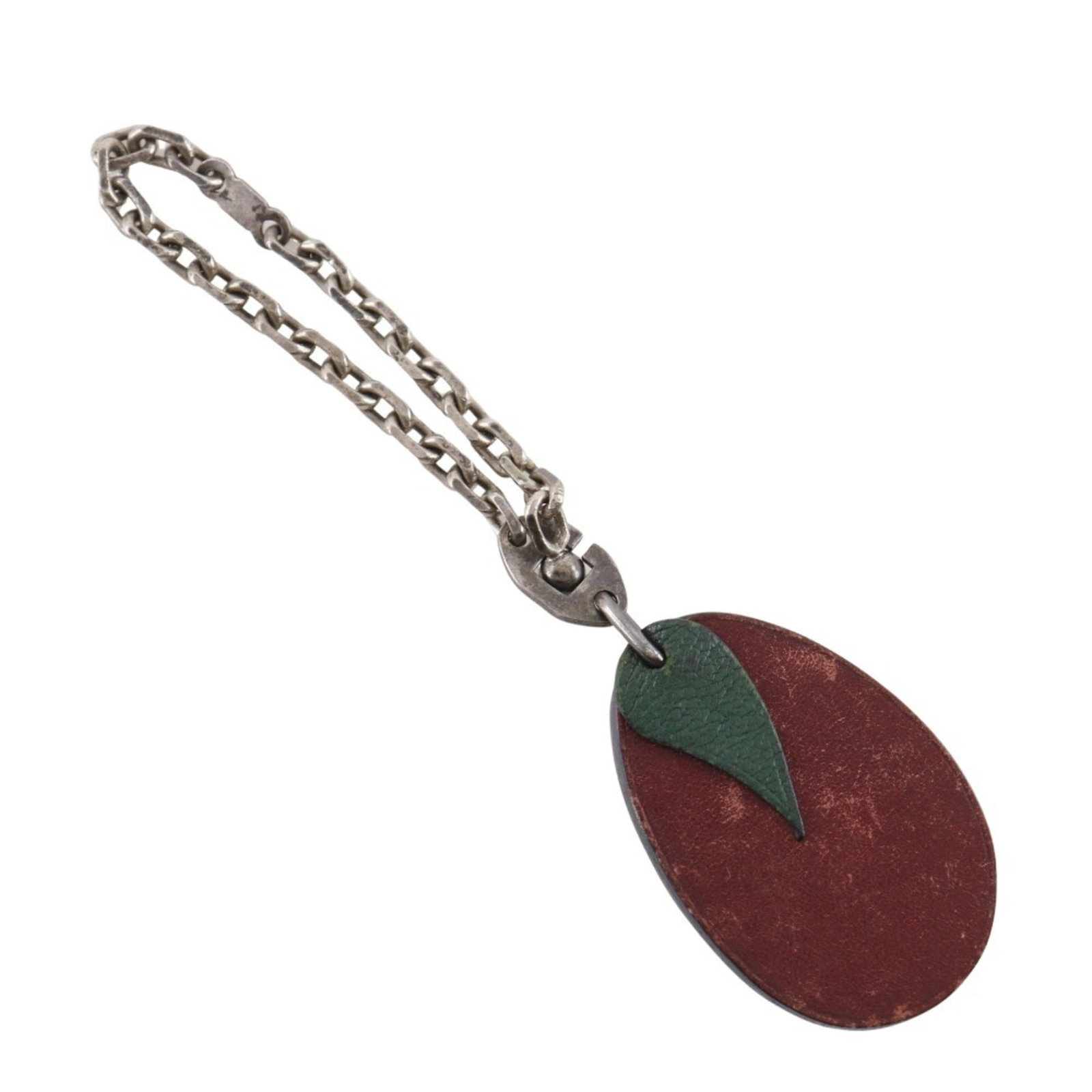 Hermes handbag charm leather: Hermes handbag charm leather Red Hermes handbag charm leather, measuring 110.00mm x 28.00mm, bears traces of usage and minor damages/dirt. The item's condition is acceptable for continued use despite 