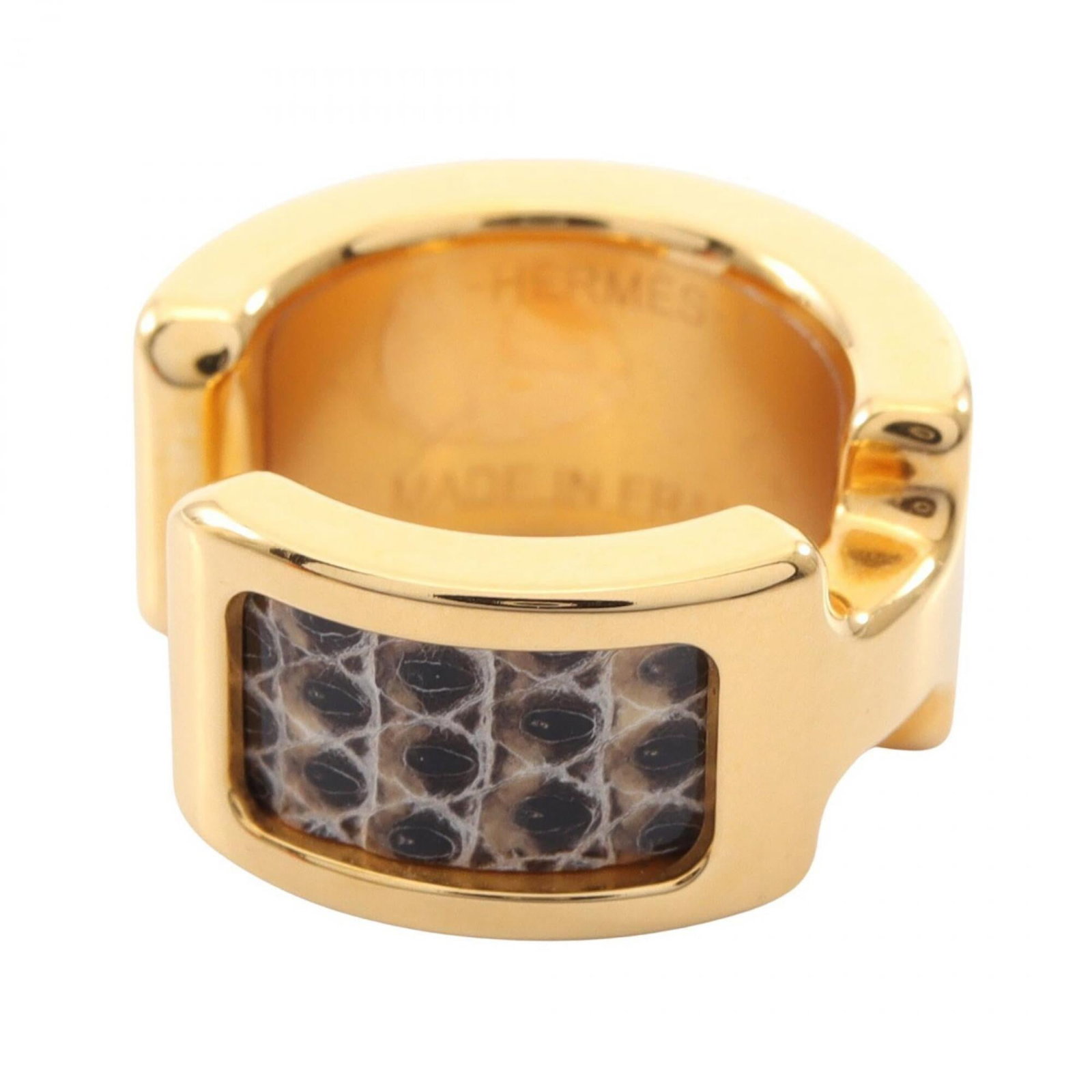 Leather Gold Plating Earcuff by Hermes: Leather Gold Plating Earcuff by Hermes Gold Plating and Leather Earcuff by Hermes in Black and Gold. This elegant earcuff features gold plating and leather, with a sleek black finish. Measuring 8.00mm