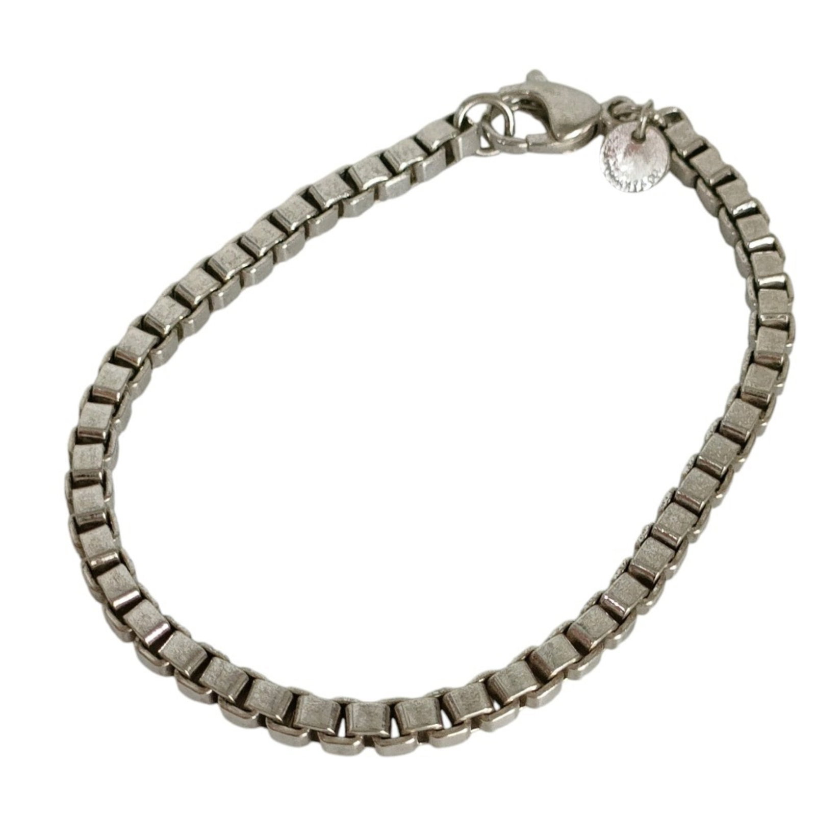 Tiffany Charm of Bracelet: Tiffany Charm of Bracelet Silver Tiffany Charm Bracelet, measuring 18.5cm in length, features a nearly new condition with only minor signs of usage. This like-new charm bracelet boasts a silver
