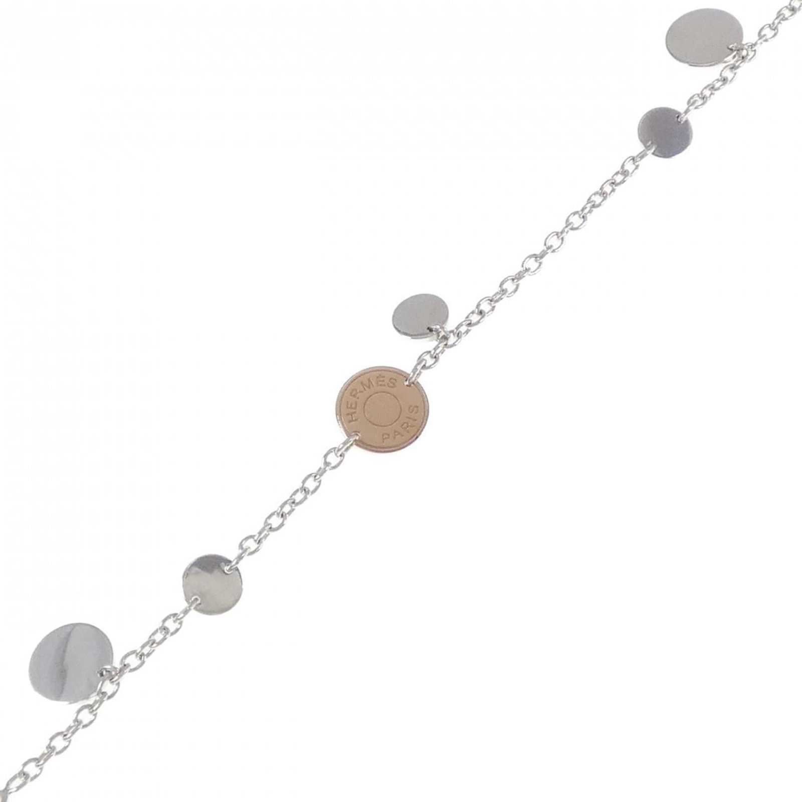 Charm bracelet pink gold silver 925 by Hermes: Charm bracelet pink gold silver 925 by Hermes Pink Gold and Silver Charm Bracelet by Hermes. This 18K pink gold and sterling silver charm bracelet features intricate details and a classic design, meas