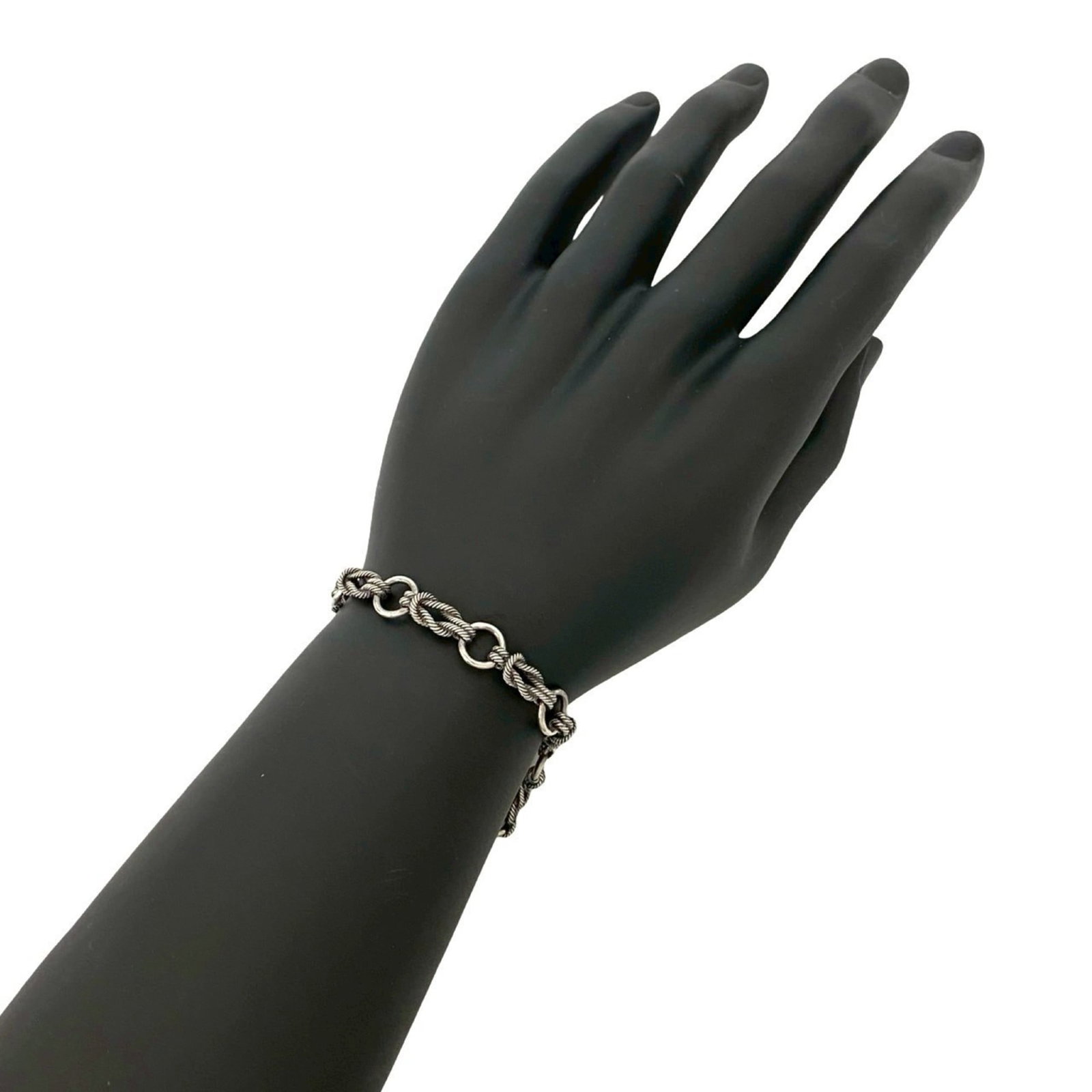 Silver Charm Bracelet 925 by Hermes: Silver Charm Bracelet 925 by Hermes Silver Charm Bracelet 925 by Hermes, featuring a classic design with subtle wear from previous use. The bracelet measures 17cm in length and showcases a silver