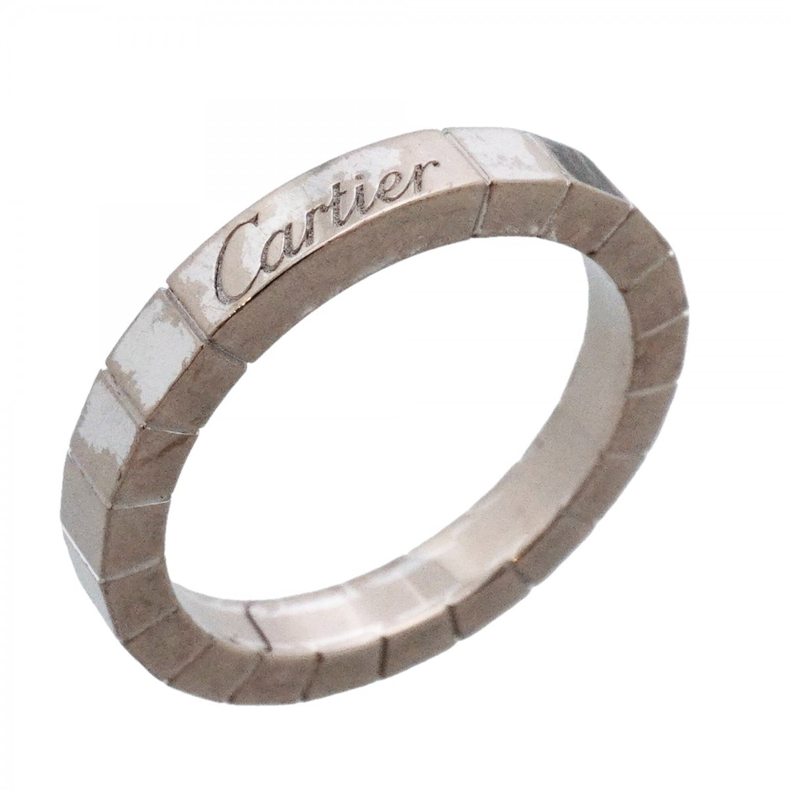 White Gold Cartier Band Ring 18K: White Gold Cartier Band Ring 18K White Gold Cartier Band Ring 18K features an 18k white gold band with intricate details, showcasing the luxury brand's signature style. This used ring has traces of