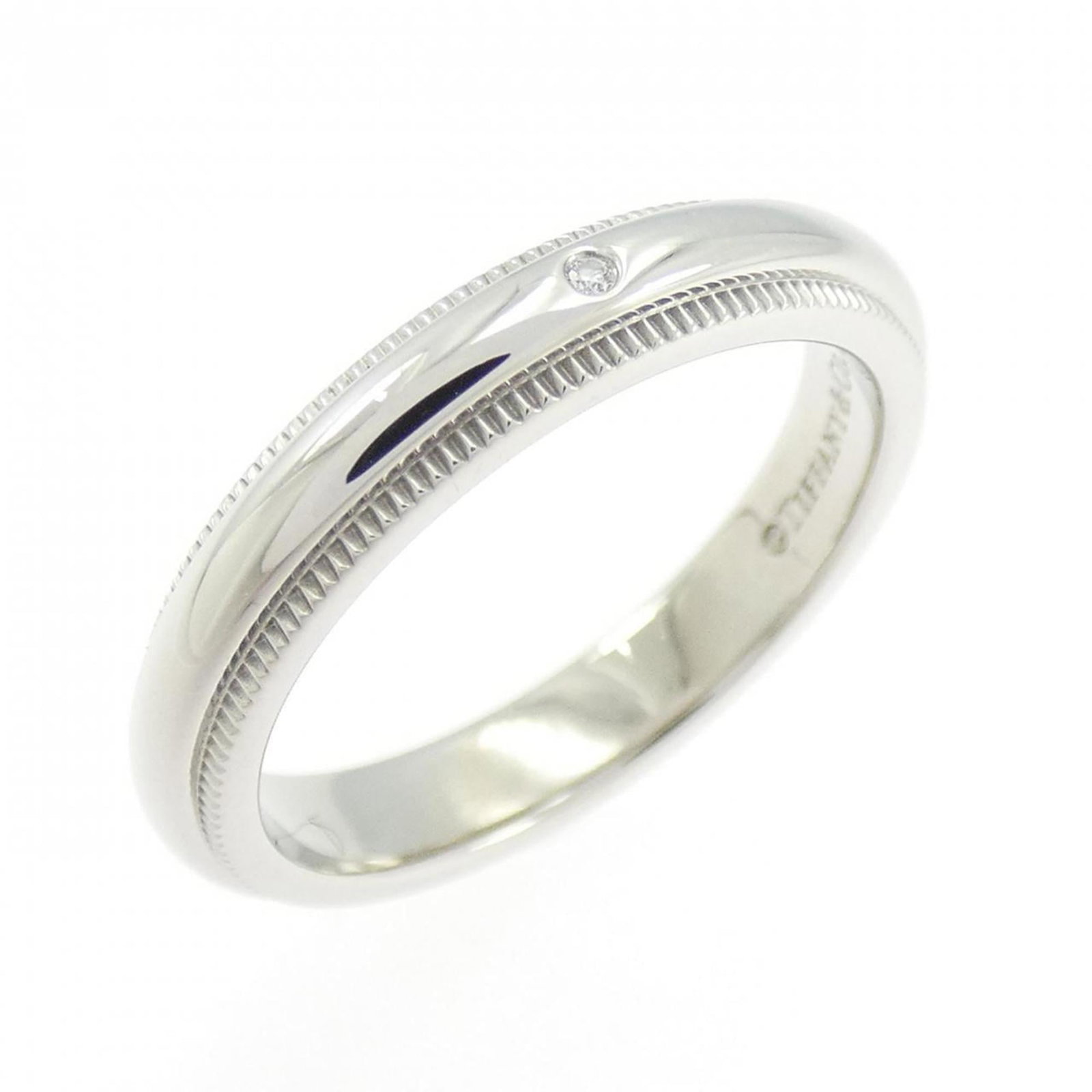 Platinum ring by Tiffany band: Platinum ring by Tiffany band Platinum ring by Tiffany features a diamond stone set in a band style ring, crafted from high-quality platinum material. The item is available in US size 4 and has been c