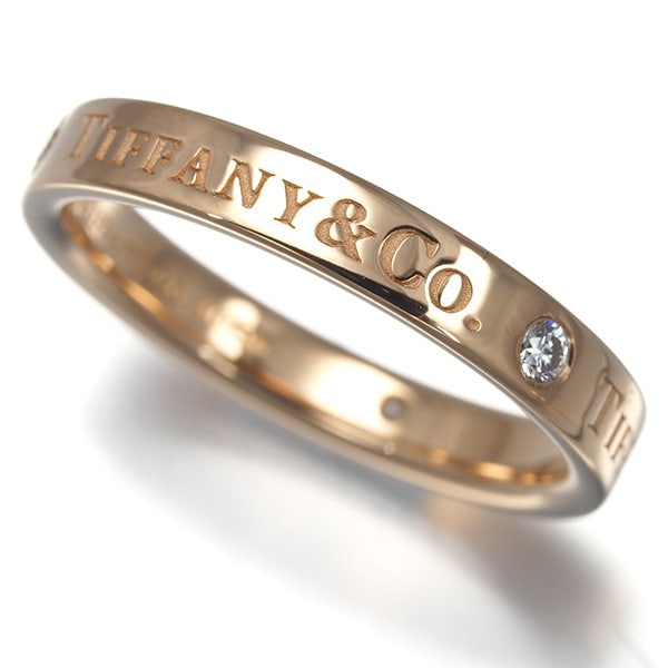 Tiffany&Co. Ring Diamond Flat Band 3P Us5.25-5.5 18K 750 Rose Gold: Tiffany&Co. Ring Diamond Flat Band 3P Us5.25-5.5 18K 750 Rose Gold Tiffany & Co.'s iconic flat band ring showcases a natural diamond set in an elegant 18k rose gold setting. This timeless piece boasts