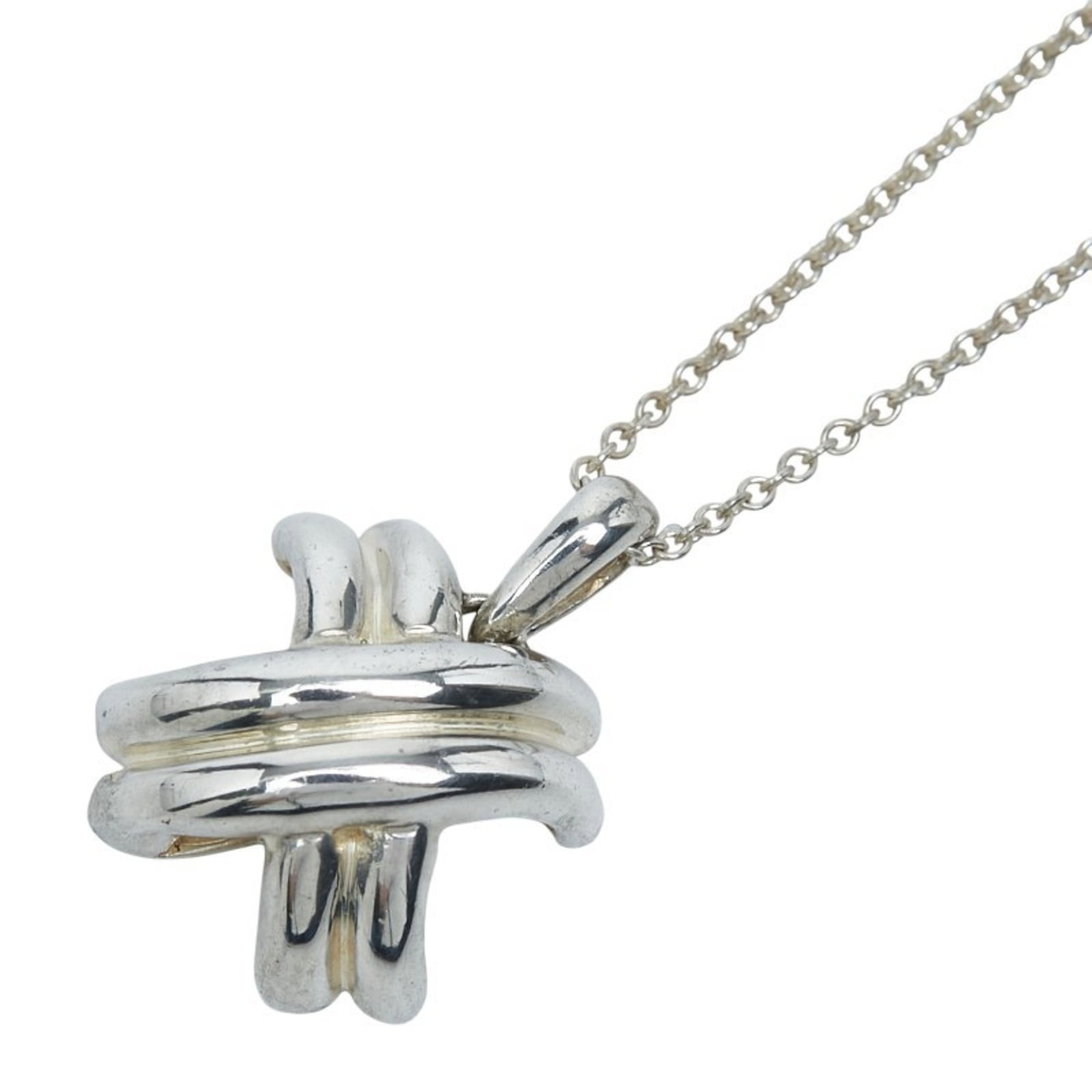 Tiffany & Co. Signature Cross Necklace Pendant In 925 Sterling Silver For Women: Tiffany & Co. Signature Cross Necklace Pendant In 925 Sterling Silver For Women Tiffany & Co.'s iconic silver pendant features the brand's signature cross design, a timeless and elegant touch for wome
