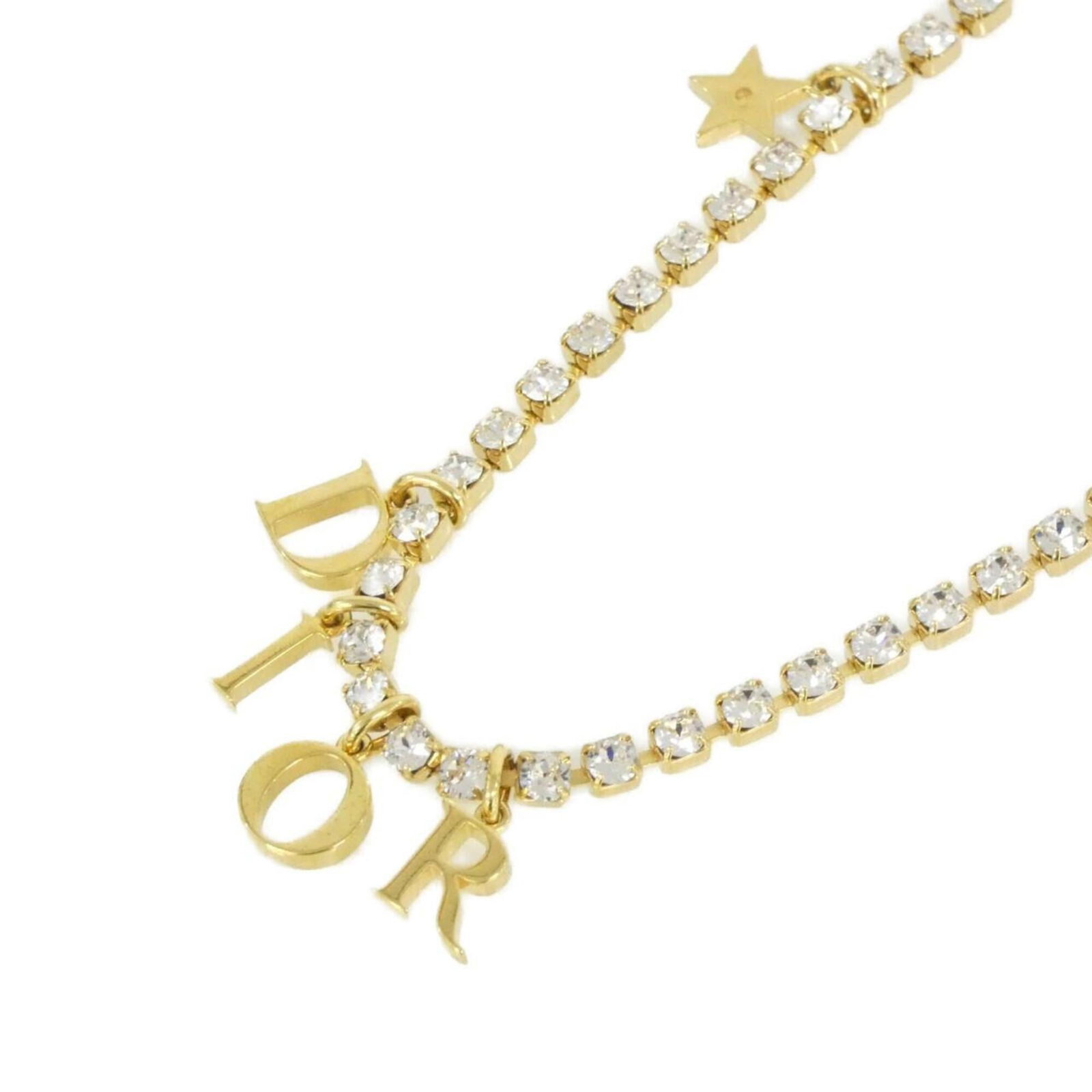 Christian Dior Revolution N3117Womcy Necklace: Christian Dior Revolution N3117Womcy Necklace The Christian Dior Revolution N3117Womcy Necklace boasts a sleek, modern design with a clear, gold pendant. Its slender chain and petite 10mm x 10mm