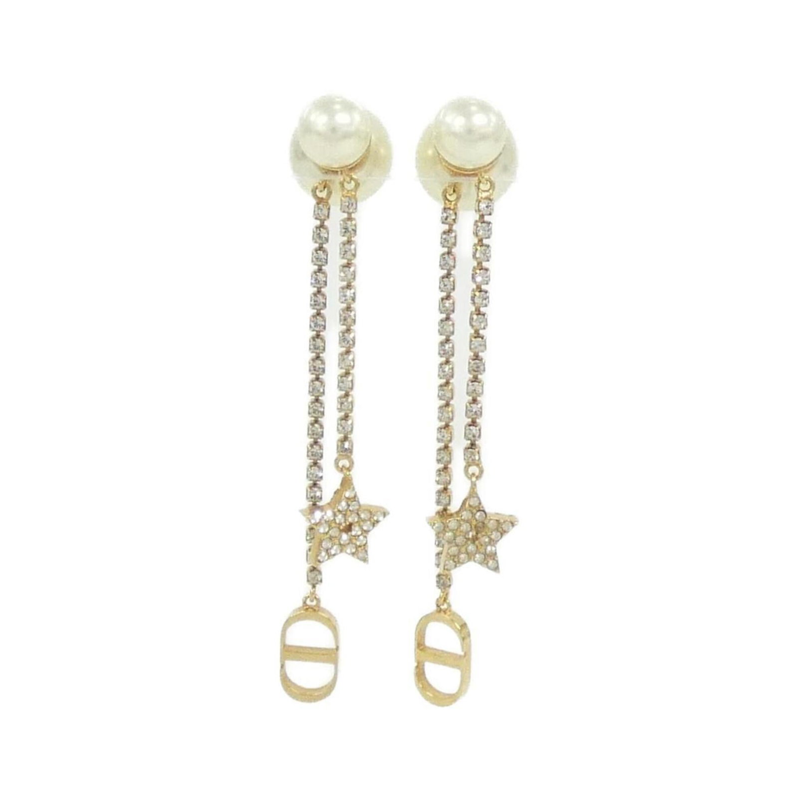 Stud Earrings by Christian Dior: Stud Earrings by Christian Dior Stud earrings by Christian Dior, featuring clear and white settings, are available in a unique size of 5.30mm x 1.10mm / 0.21'' x 0.04''. The condition is used, with