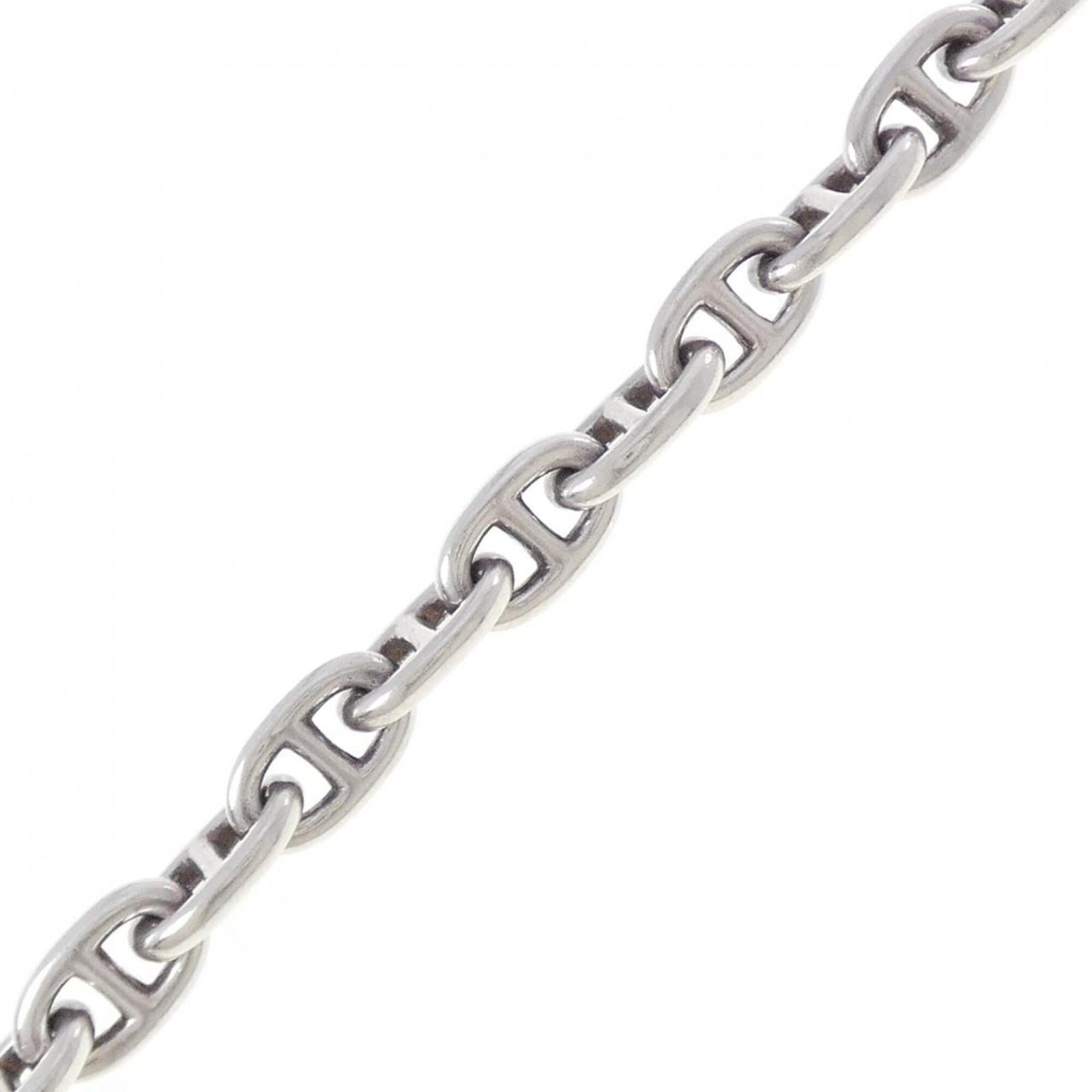 Charm Bracelet by Hermes: Charm Bracelet by Hermes Charm bracelet by Hermes, featuring a sleek design with an 8mm width and total length of 19cm. This used charm bracelet shows some signs of usage, including minor scratches an