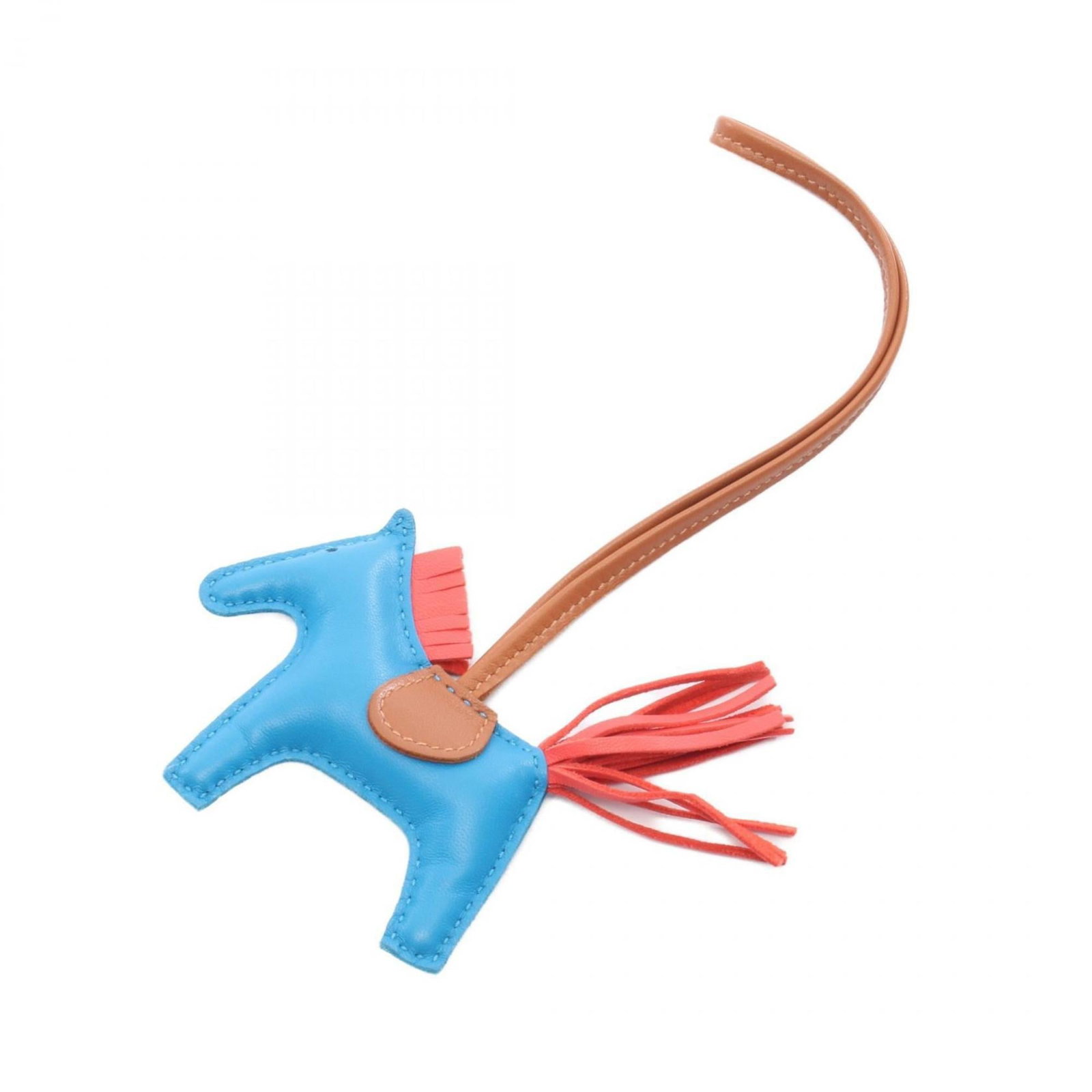 Hermes Handbag Charm Agneau Milo: Hermes Handbag Charm Agneau Milo Agneau Milo, the iconic material from Herm?s, is showcased in this charming handbag charm. The blue, brown, and red hues add a pop of color to any accessory or