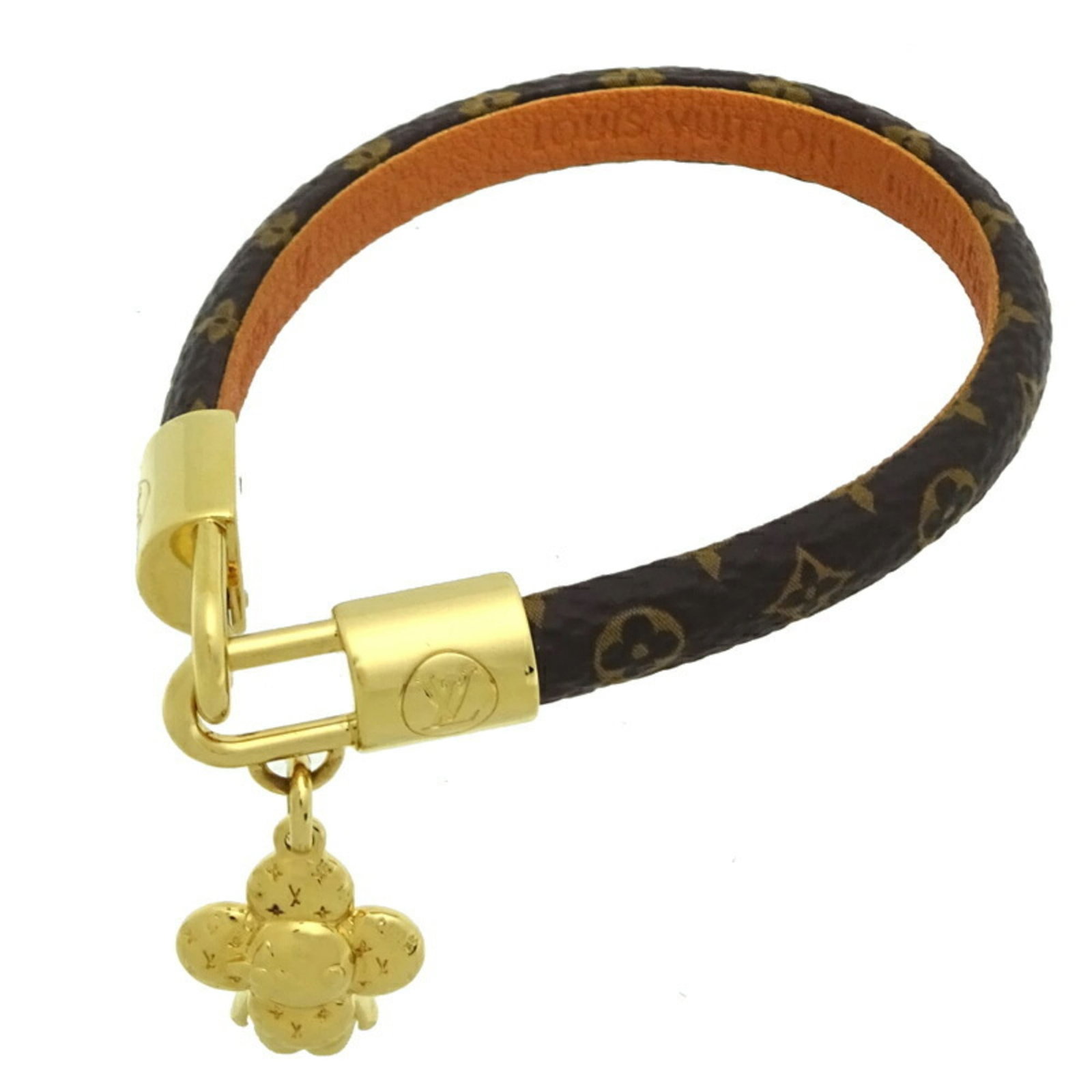 Leather Monogram Louis Vuitton Charm: Leather Monogram Louis Vuitton Charm Brown leather monogram charm with a classic Louis Vuitton design, featuring the iconic LV pattern in a timeless brown color. Made from high-quality calf leather,