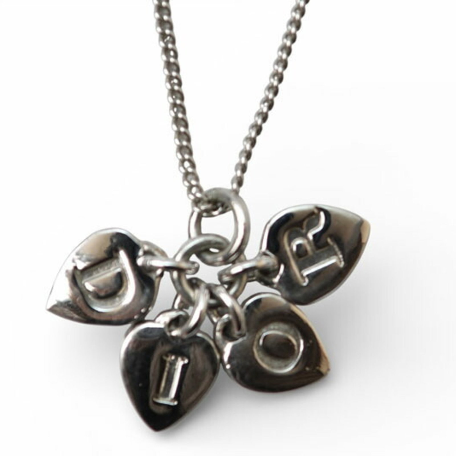 Christian Dior Necklace Motif With Silver Heart: Christian Dior Necklace Motif With Silver Heart Silver heart pendant on a chain from Christian Dior, featuring the iconic Motif design. This casual necklace boasts a sleek 10mm x 14mm pendant and