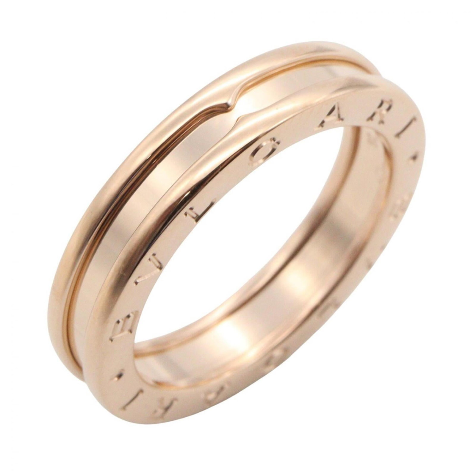 Pink Gold 18K Bvlgari Band Ring: Pink Gold 18K Bvlgari Band Ring Pink Gold 18K Bvlgari Band Ring features the iconic brand's signature style in a beautiful pink gold finish. With its elegant design and high-quality material, this ban