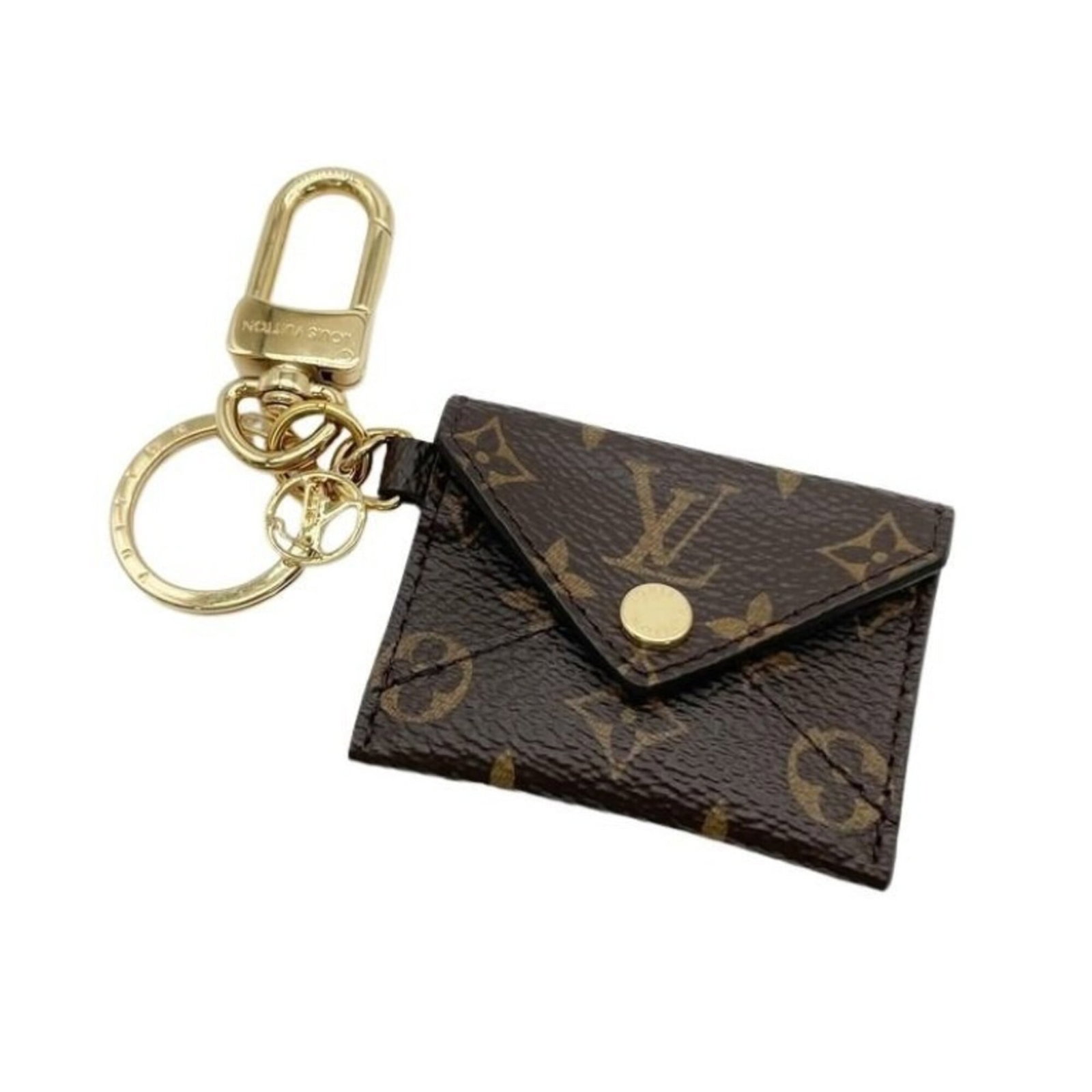 Handbag Monogram Louis Vuitton: Handbag Monogram Louis Vuitton Brown Louis Vuitton Monogram Handbag Charm. This used handbag charm features the iconic monogram pattern in brown and measures 50.00mm x 60.00mm. It has a few traces of