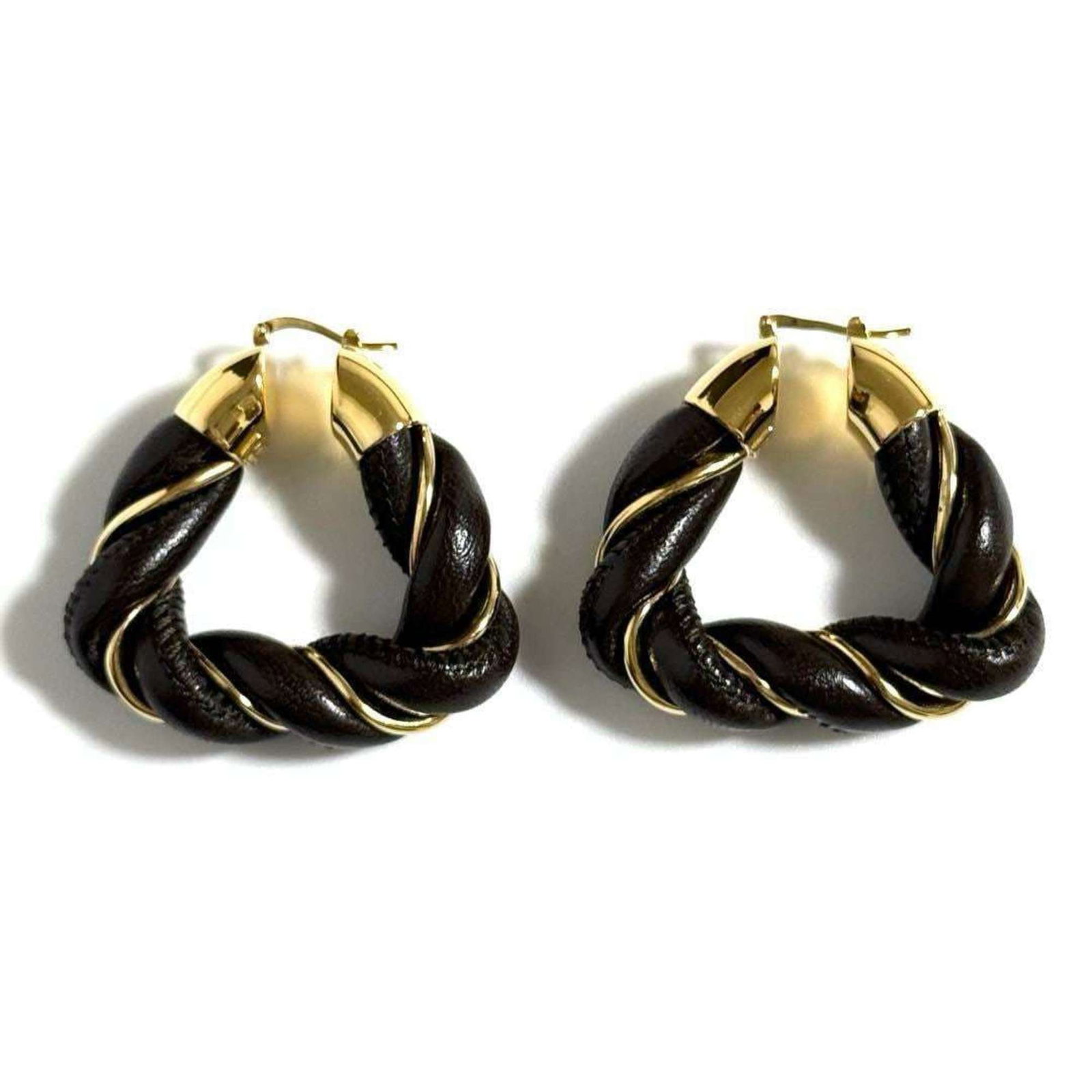 Veneta Leather Hoop Earrings Silver 925: Veneta Leather Hoop Earrings Silver 925 Bottega Veneta's Veneta Leather Hoop Earrings in Dark Brown feature high-quality silver 925 details, showcasing the brand's signature style. Made from genuine l
