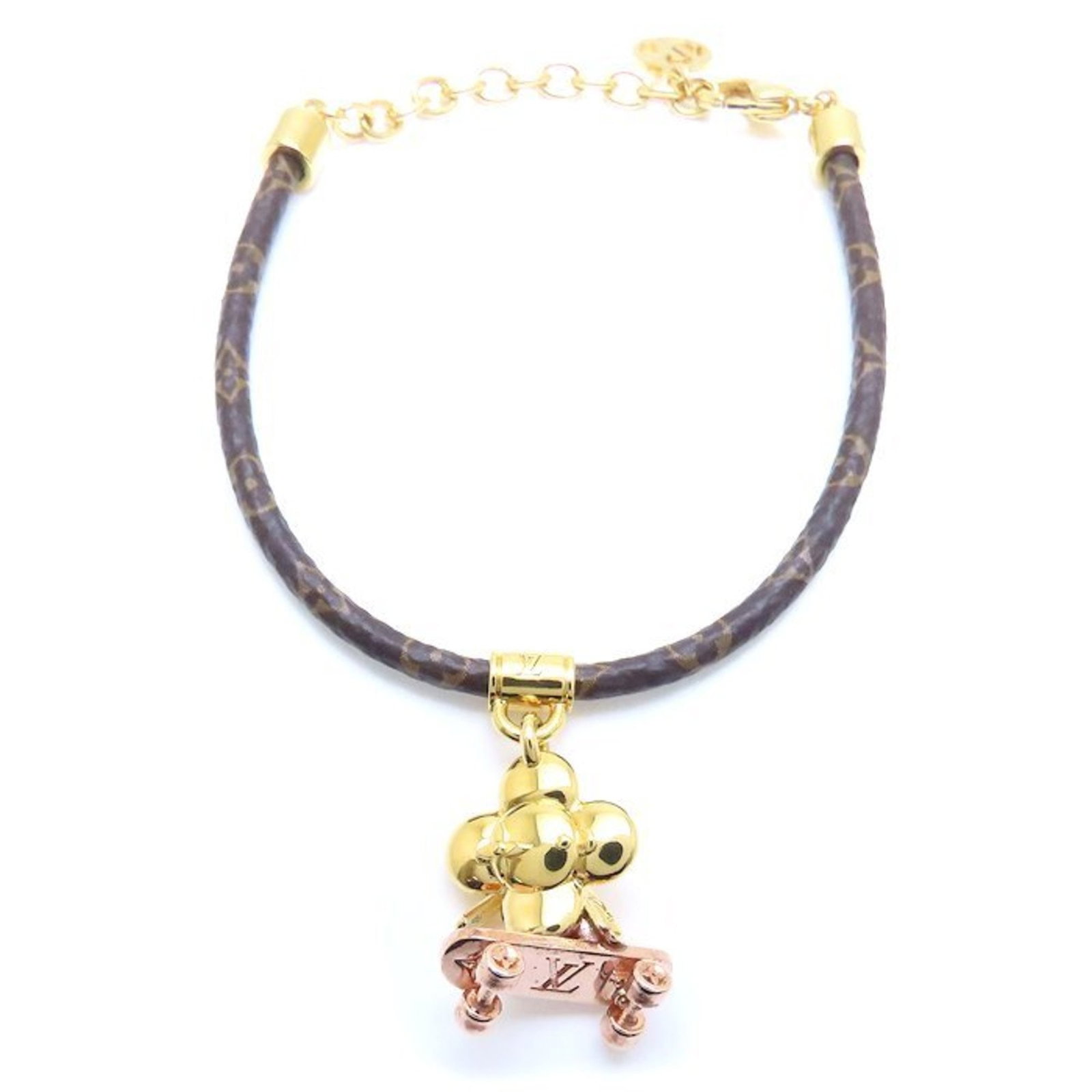 Charm Bracelet Gold Plating Monogram Louis Vuitton: Charm Bracelet Gold Plating Monogram Louis Vuitton Gold Plated Monogram Louis Vuitton Charm Bracelet, featuring the iconic LV monogram in gold plating. This used charm bracelet measures between 15.5cm