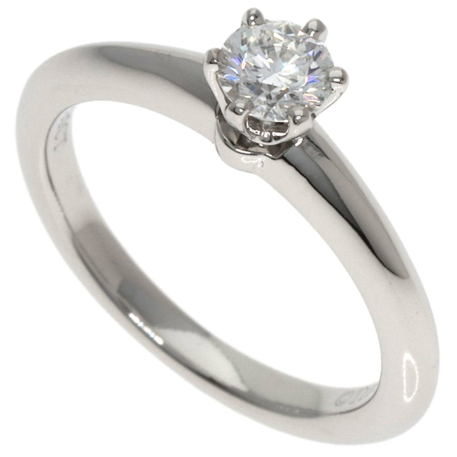Platinum ring by Tiffany band: Platinum ring by Tiffany band Platinum ring by Tiffany features a diamond stone weighing 0.25 carats, set in a 3.7g platinum band with an US size of 3.5. The ring bears some scratches and dirt, but
