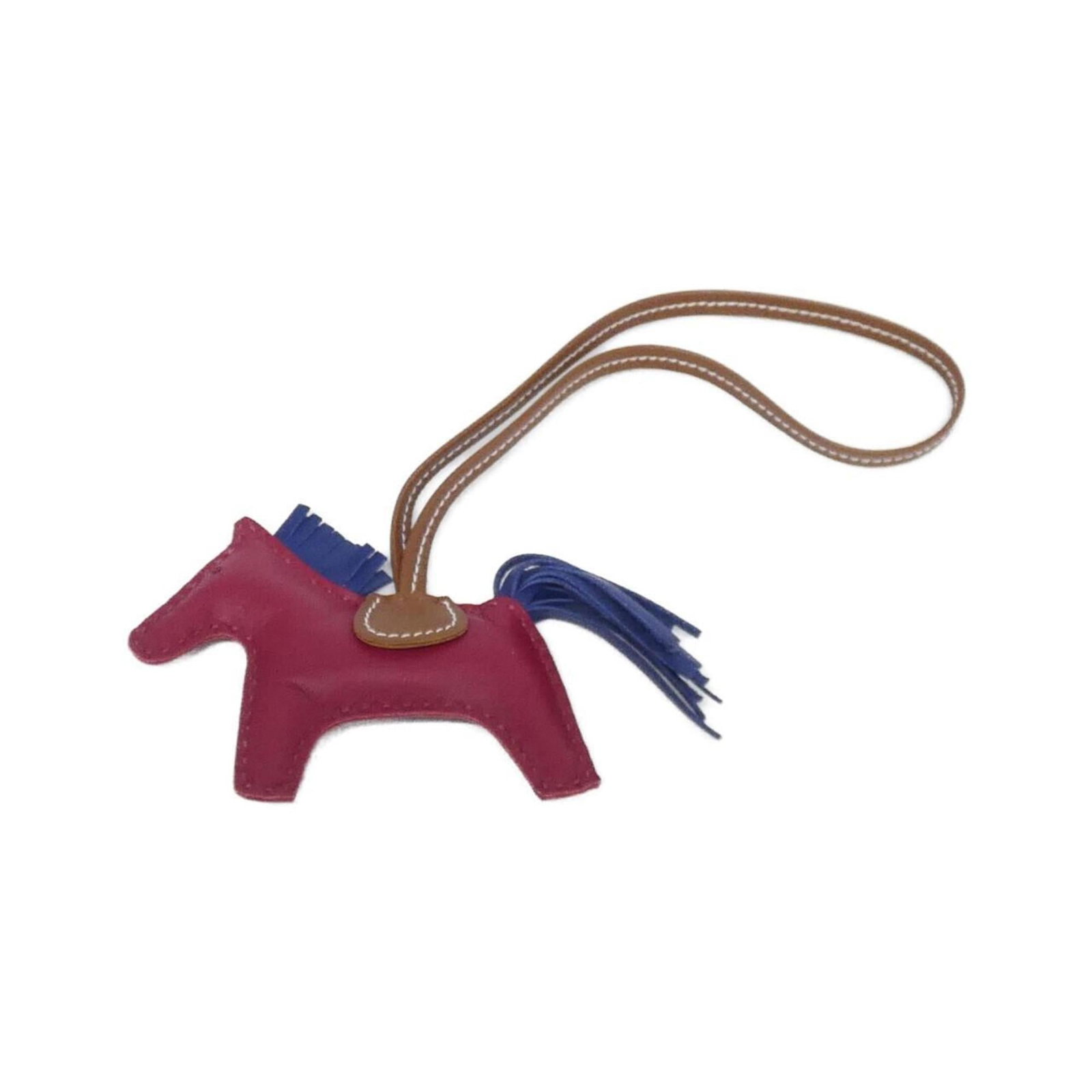 Hermes Handbag Charm Agneau Milo: Hermes Handbag Charm Agneau Milo Agneau Milo charm from Hermes, featuring a unique blue, fauve, and ruby color combination. This handbag charm measures 75mm x 85mm and comes with a 14.57" chain