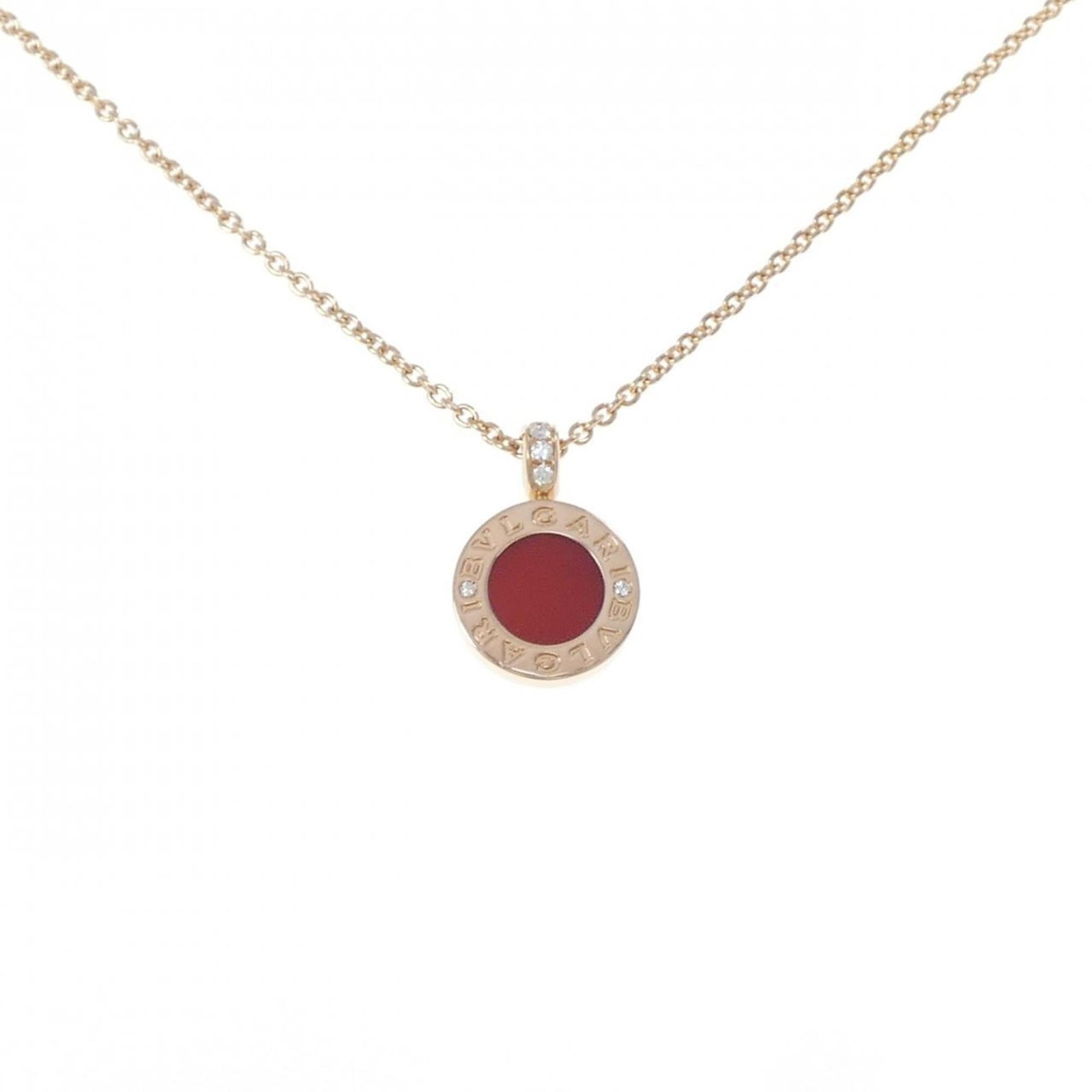 Bvlgari Necklace: Bvlgari Necklace Bvlgari's iconic necklace features a stunning combination of pink carnelian, diamond, and mother of pearl, set in 18K gold. The pendant measures 19mm x 13mm and is suspended from a ad