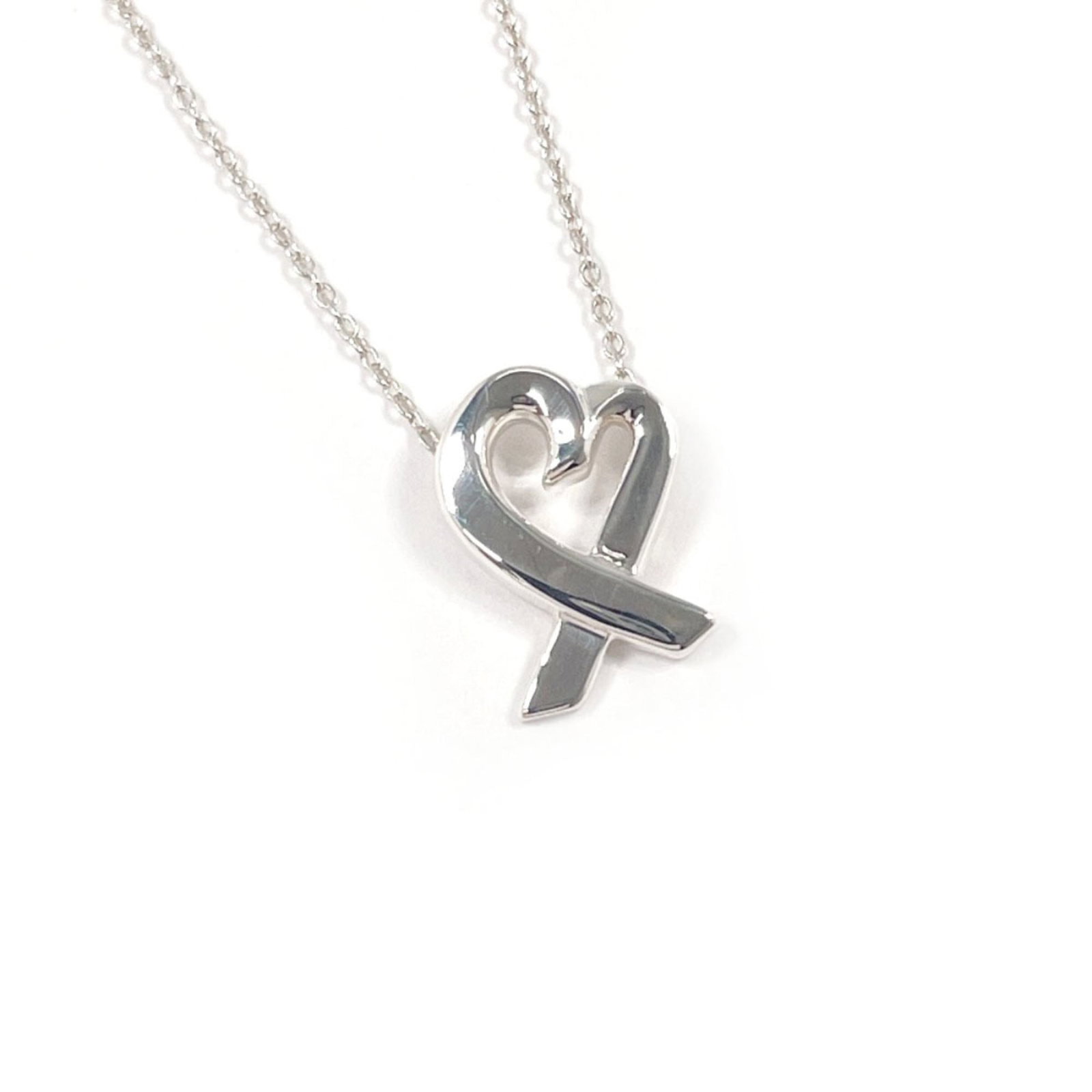 Women's Sterling Silver Paloma Picasso Tiffany Loving Necklace Heart: Women's Sterling Silver Paloma Picasso Tiffany Loving Necklace Heart Sterling silver necklace with Paloma Picasso design, featuring a heart-shaped pendant. The necklace boasts a unique and elegant des