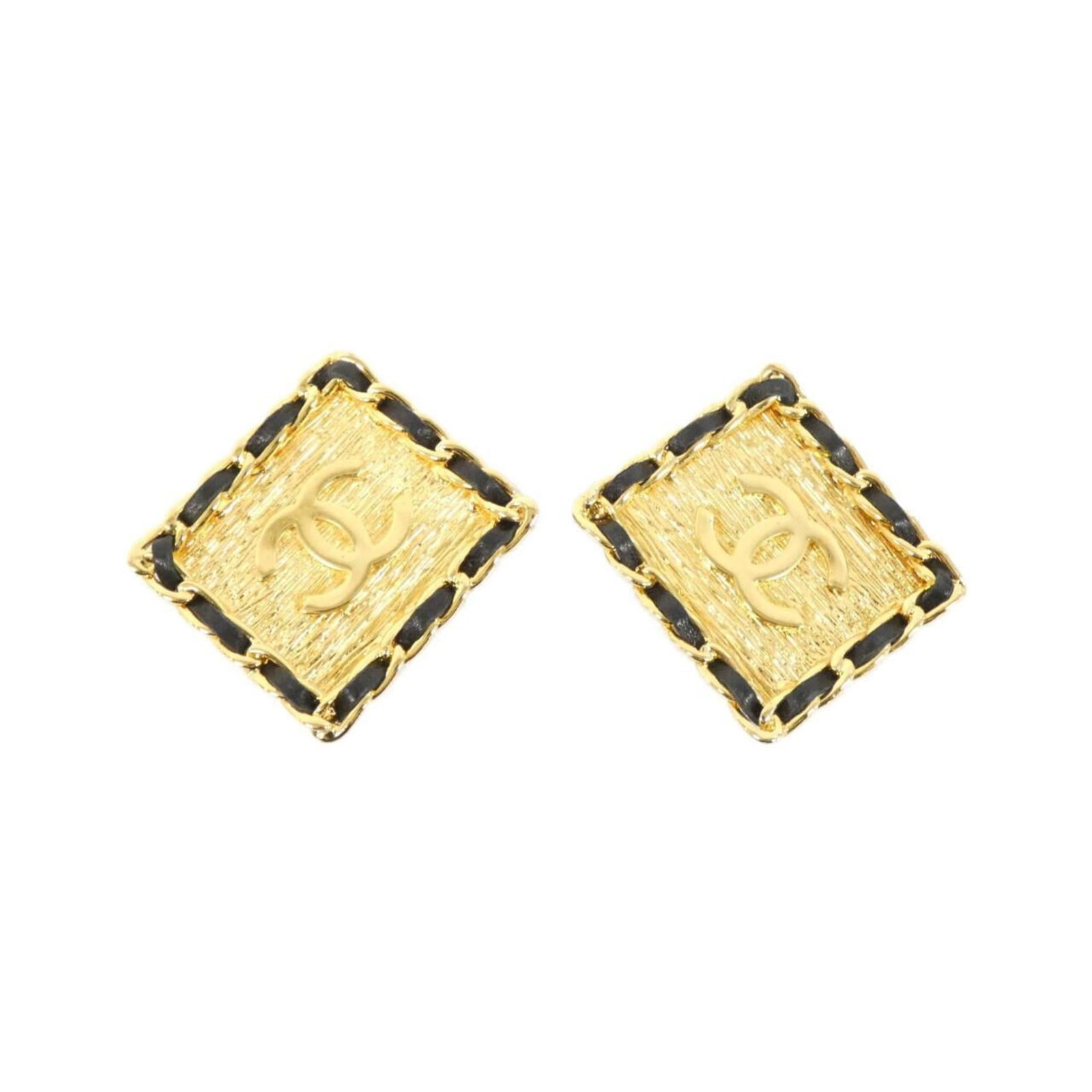 Chanel Clip Earrings Leather: Chanel Clip Earrings Leather Black leather clip earrings from Chanel, featuring a sleek and sophisticated design. Made from high-quality leather, these earrings have a subtle wear and tear, with some