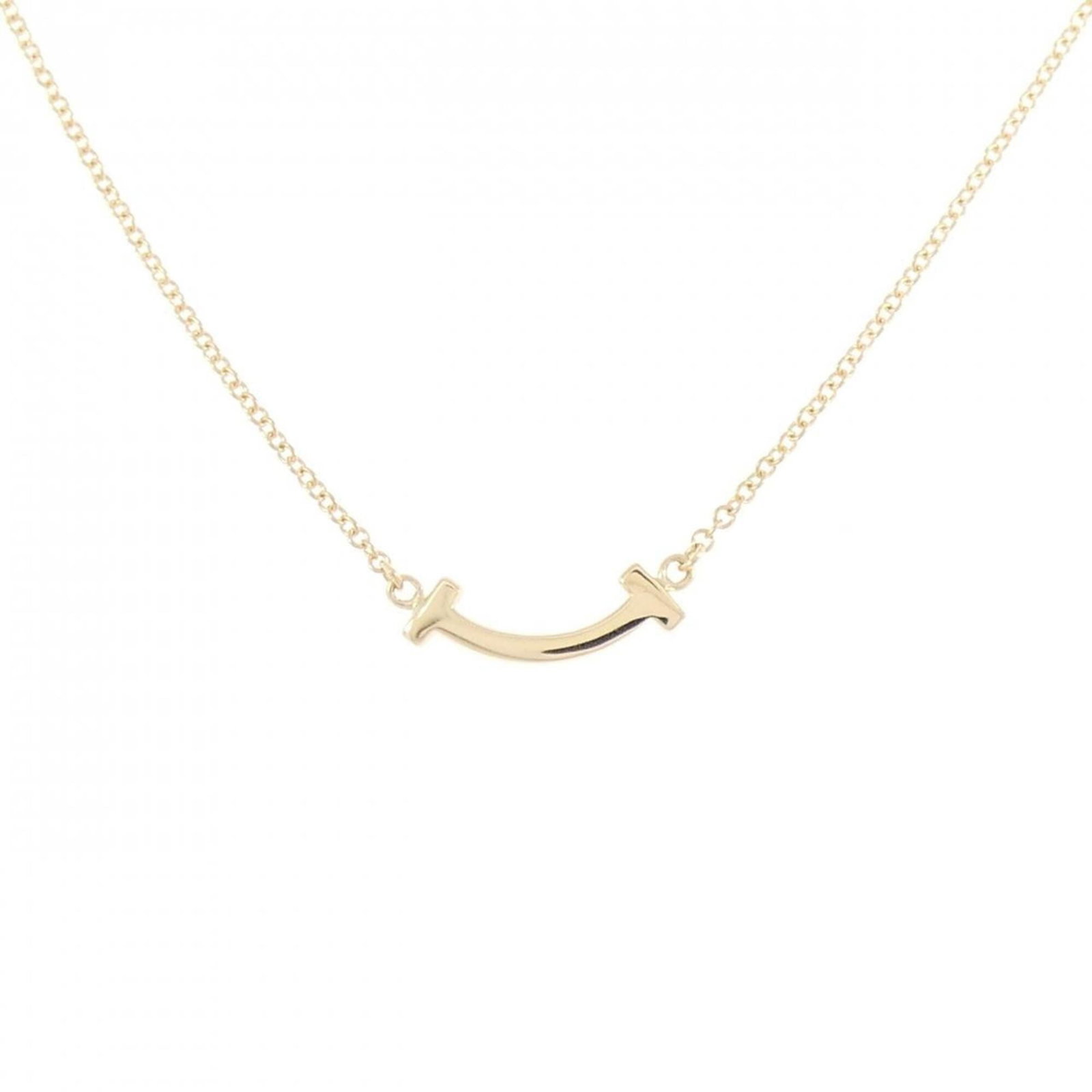 Mini Tiffany T Smile Necklace: Mini Tiffany T Smile Necklace Yellow Gold (18K) Mini Tiffany T Smile Necklace, featuring a 3.6mm x 13.4mm pendant with a subtle smile design, crafted in 18K yellow gold and available in a range of nec