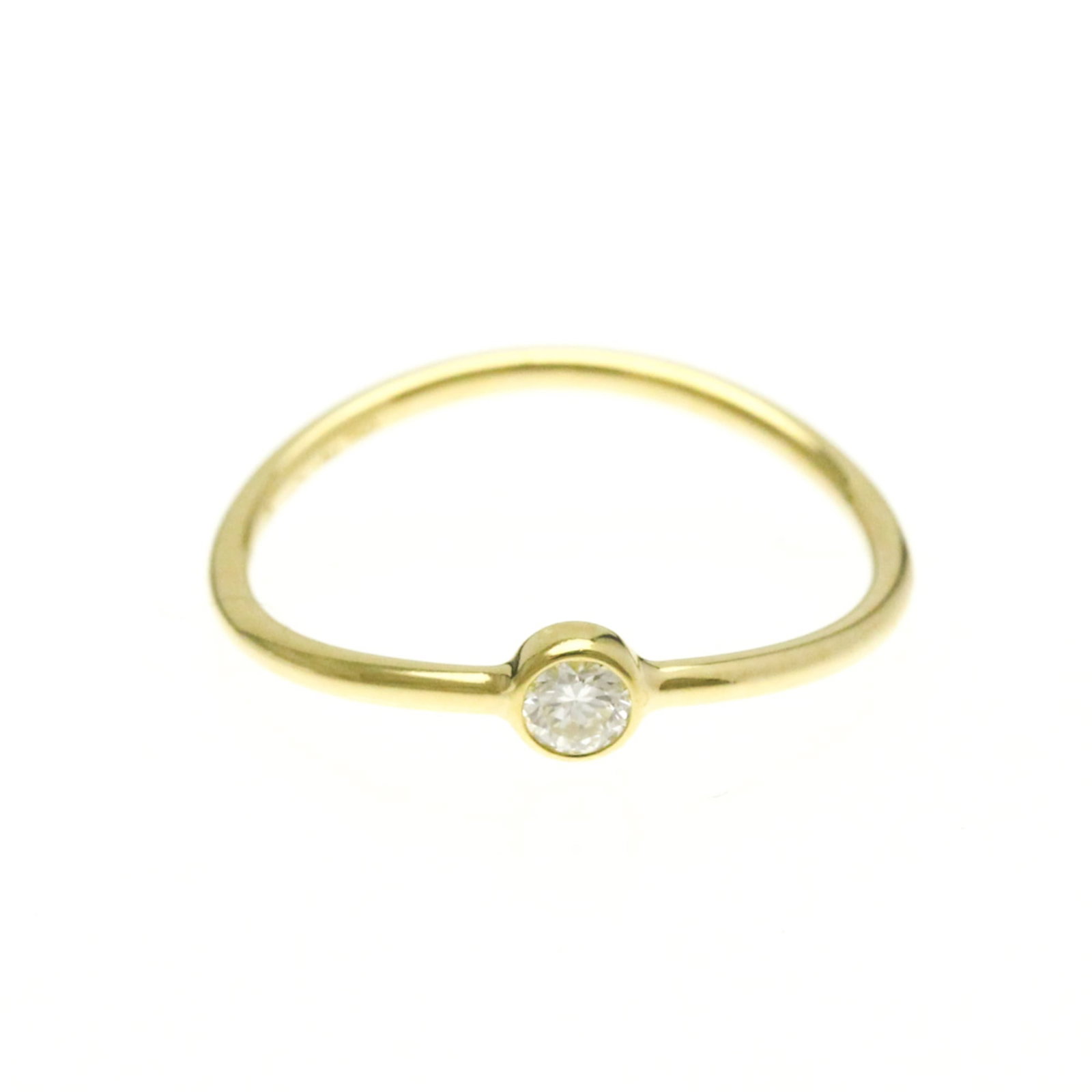 Tiffany Ring Gold Yellow 18K: Tiffany Ring Gold Yellow 18K Tiffany's iconic gold yellow band ring showcases a beautiful diamond set in 18K yellow gold. This fashion-forward design boasts a slender profile and elegant lines,