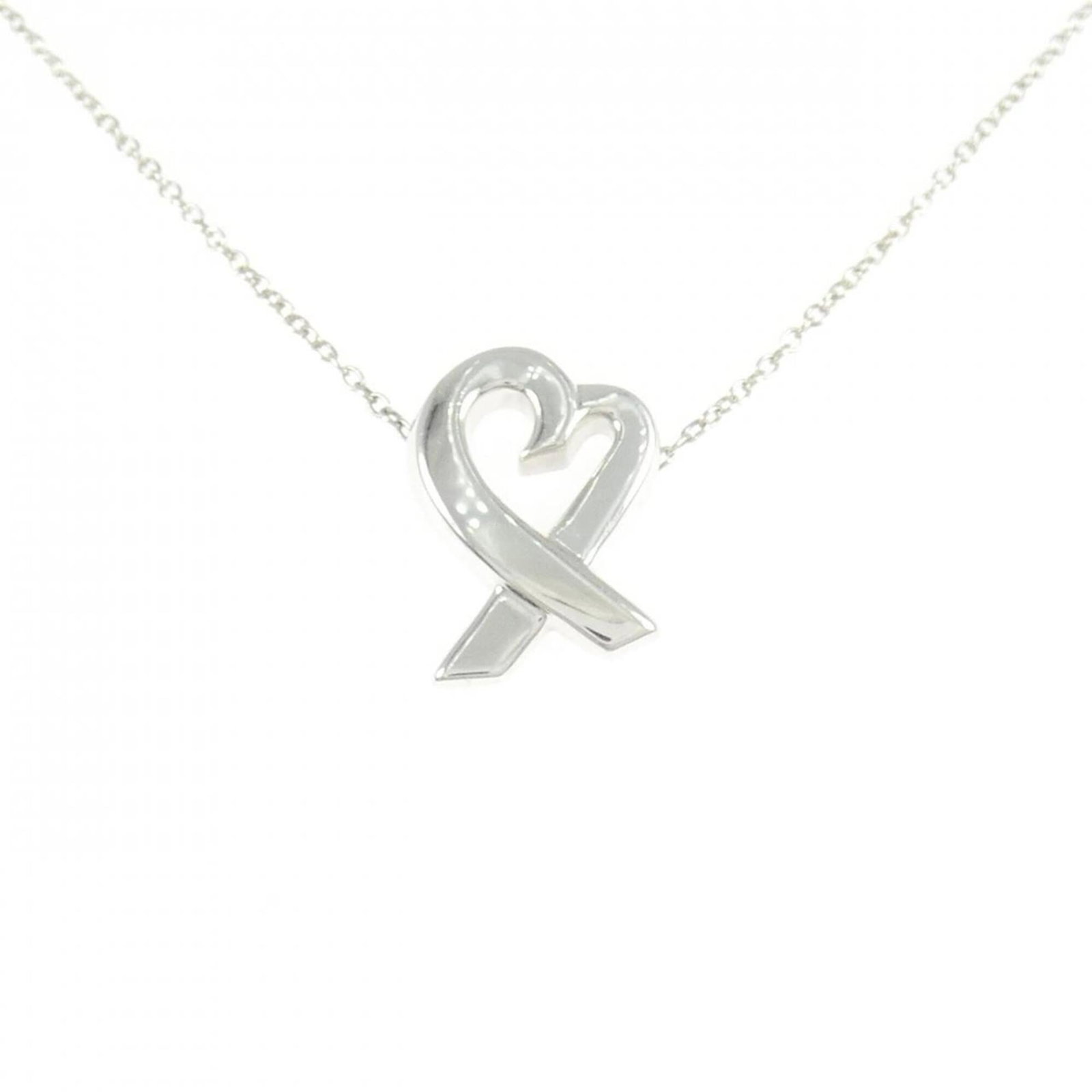 Small Loving Heart Necklace by Tiffany: Small Loving Heart Necklace by Tiffany Small Loving Heart Necklace by Tiffany, crafted from sterling silver 925, features a delicate pendant with intricate details. The necklace boasts a classic desig