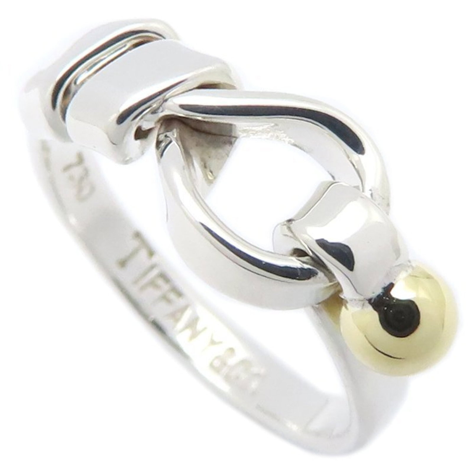 Tiffany Band Ring Silver 925 Yellow Gold (18K): Tiffany Band Ring Silver 925 Yellow Gold (18K) Silver and yellow gold band ring from Tiffany, made with high-quality materials. This 18K piece features a subtle shine and a comfortable fit, suitable f