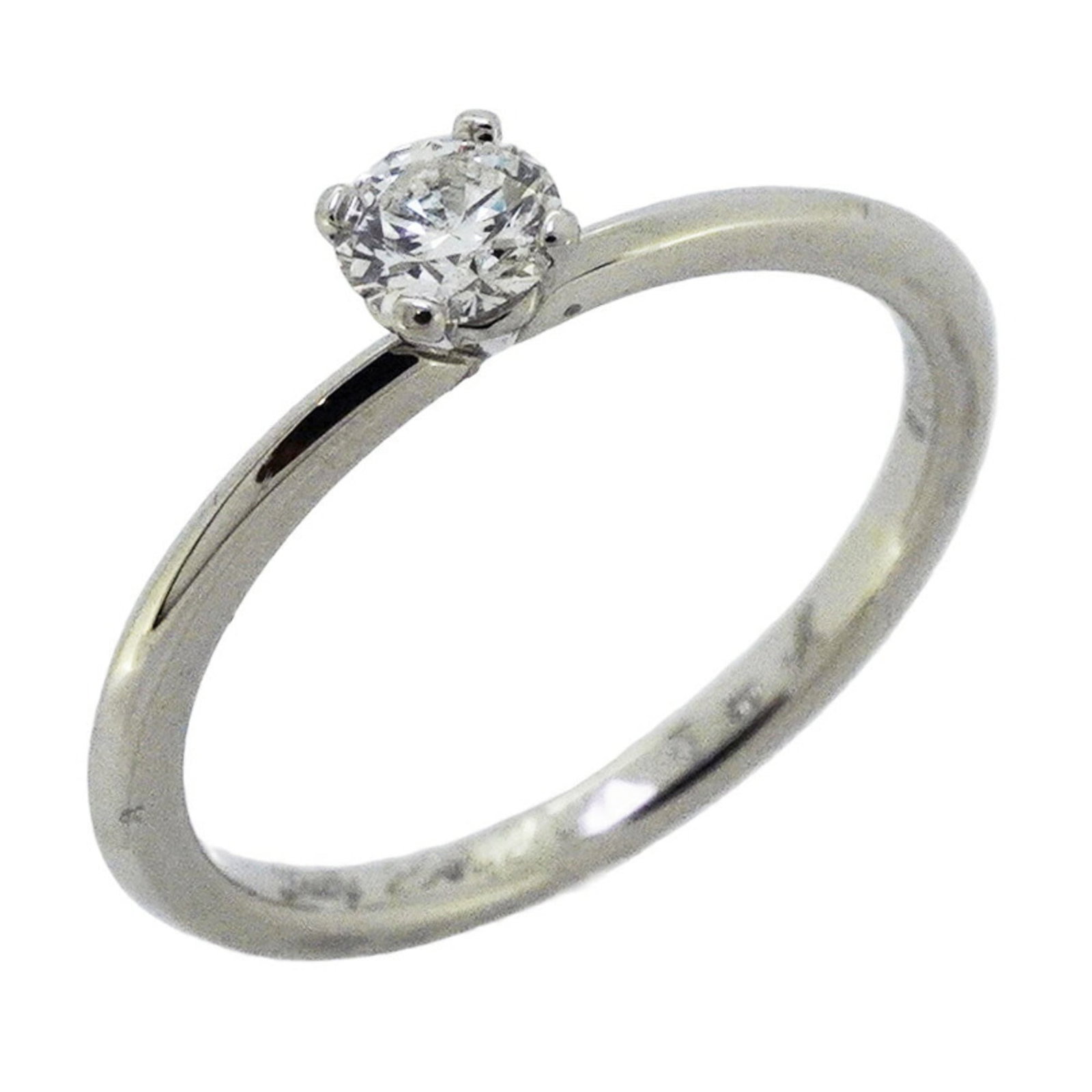 Platinum ring by Tiffany band: Platinum ring by Tiffany band Platinum ring by Tiffany features a diamond stone set in a high-quality band, showcasing the luxury hallmark of the iconic brand. The item bears traces of usage and