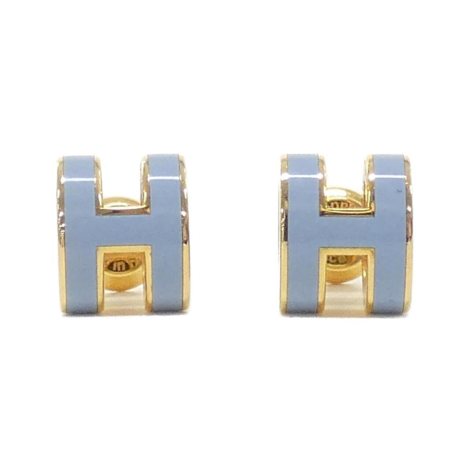 Hermes Stud Earrings: Hermes Stud Earrings Stud earrings from the renowned French fashion house Hermes, featuring a striking blue hue and elegant gold accents. Made with high-quality materials, these earrings showcase a cl