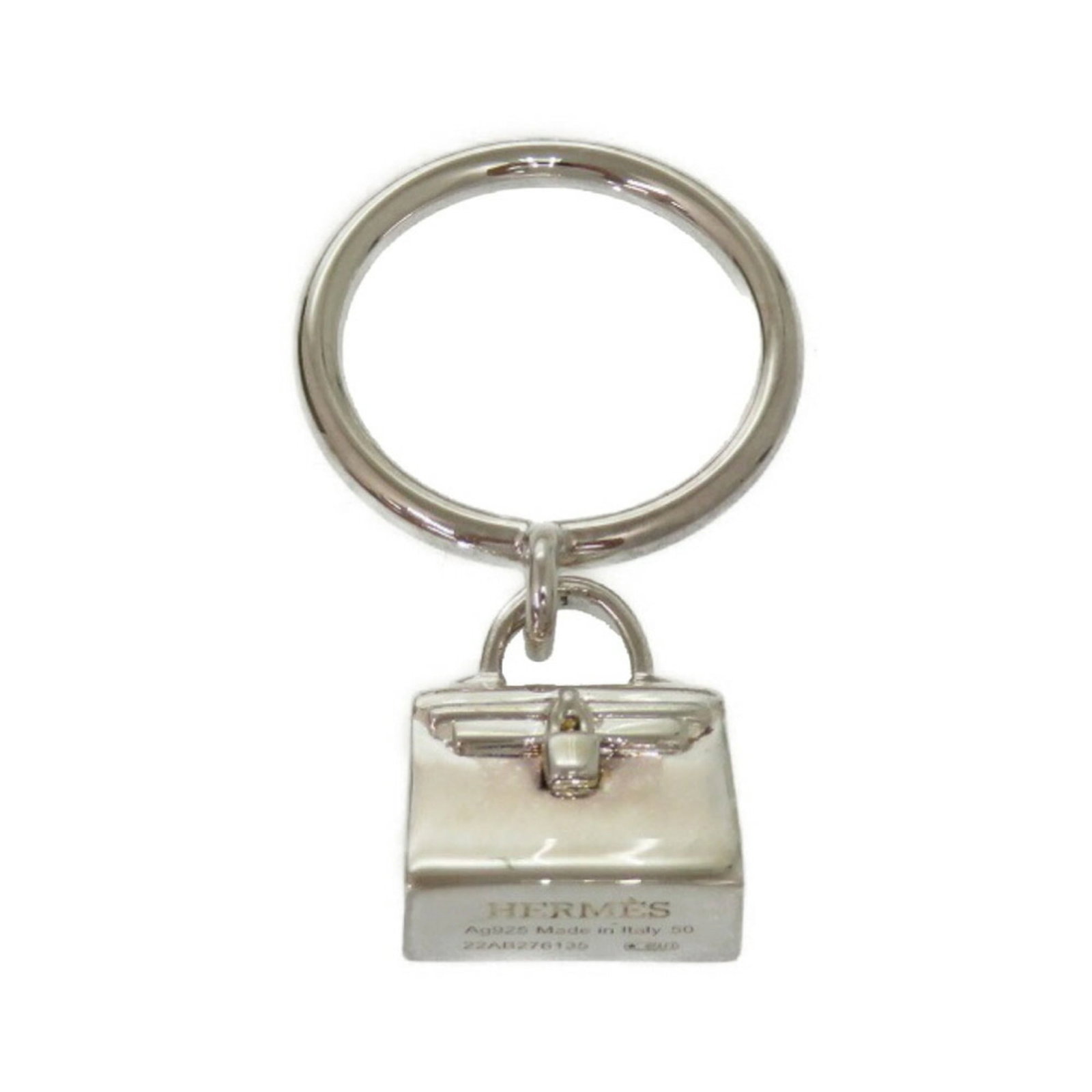 Ring Hermes Silver Band 925: Ring Hermes Silver Band 925 Silver band ring from Hermes, made from 925 sterling silver. The ring features a classic design with subtle signs of wear, reflecting its used condition. With its elegant
