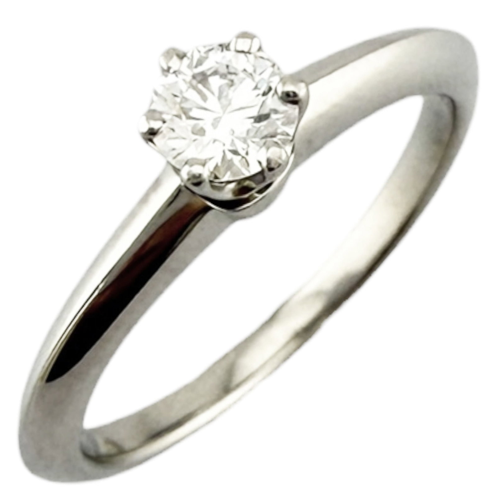 Platinum ring by Tiffany band: Platinum ring by Tiffany band Platinum ring by Tiffany features a 0.21 carat diamond, set in a high-quality platinum band with a US size 5 fit. The item has been carefully maintained and shows hardly 