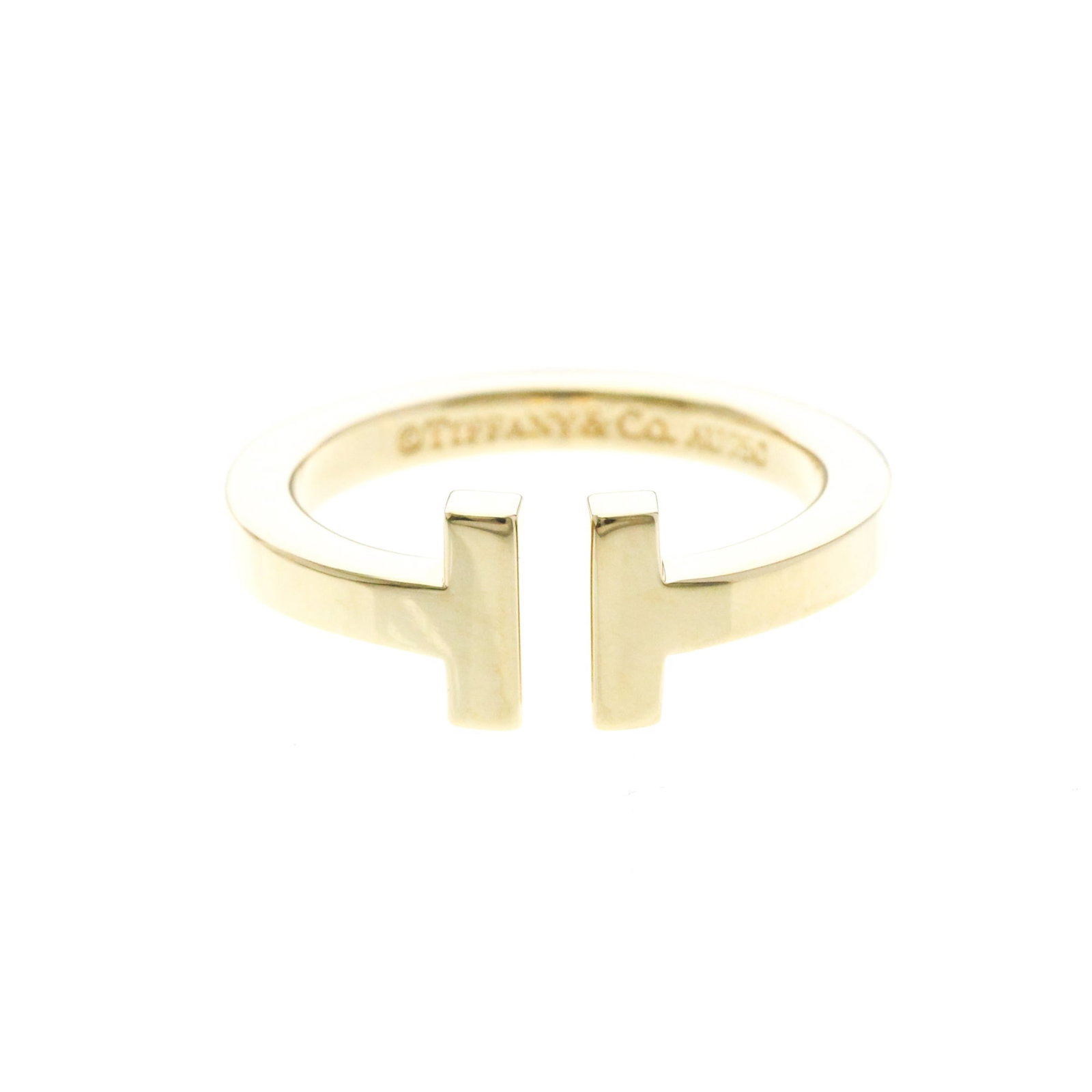 Tiffany Ring Gold Yellow 18K: Tiffany Ring Gold Yellow 18K Tiffany Ring Gold Yellow 18K - A Timeless Fashion Statement. This stunning yellow gold band ring features 18k metal and a sleek, slender design that adds a touch of sophis