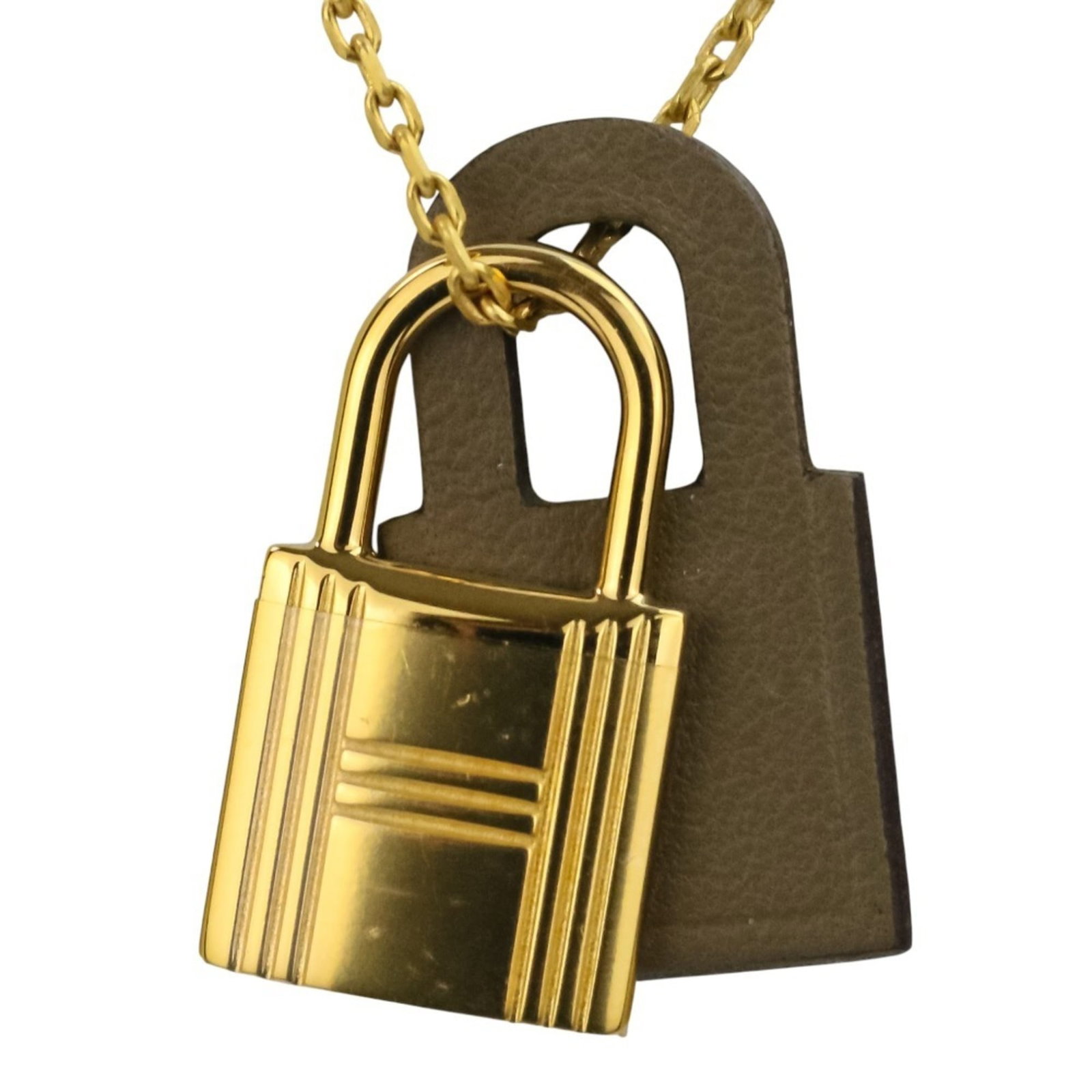 Hermes O Kelly Pendant Etoupe Gold Necklace Women: Hermes O Kelly Pendant Etoupe Gold Necklace Women Etoupe Gray and gold come together in this elegant Hermes O Kelly Pendant Etoupe Gold Necklace, featuring a delicate 2.5mm x 1.5mm pendant with a